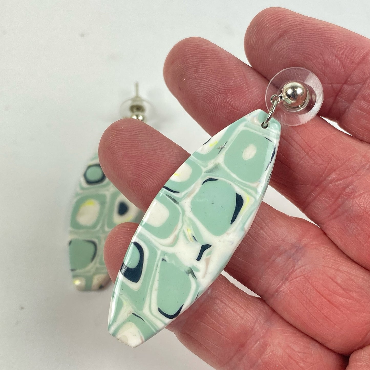 Dreamy Mint Noir Earrings handheld for size reference
