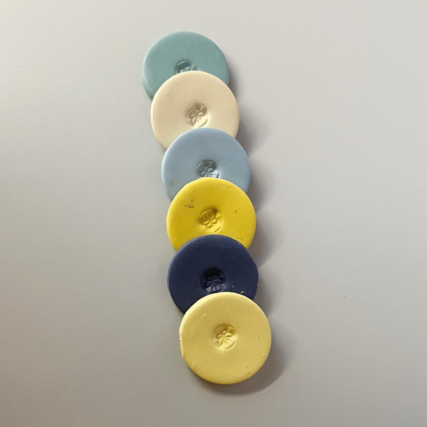 Provence Evening Polymer Clay Color Sample Discs in a cascading row