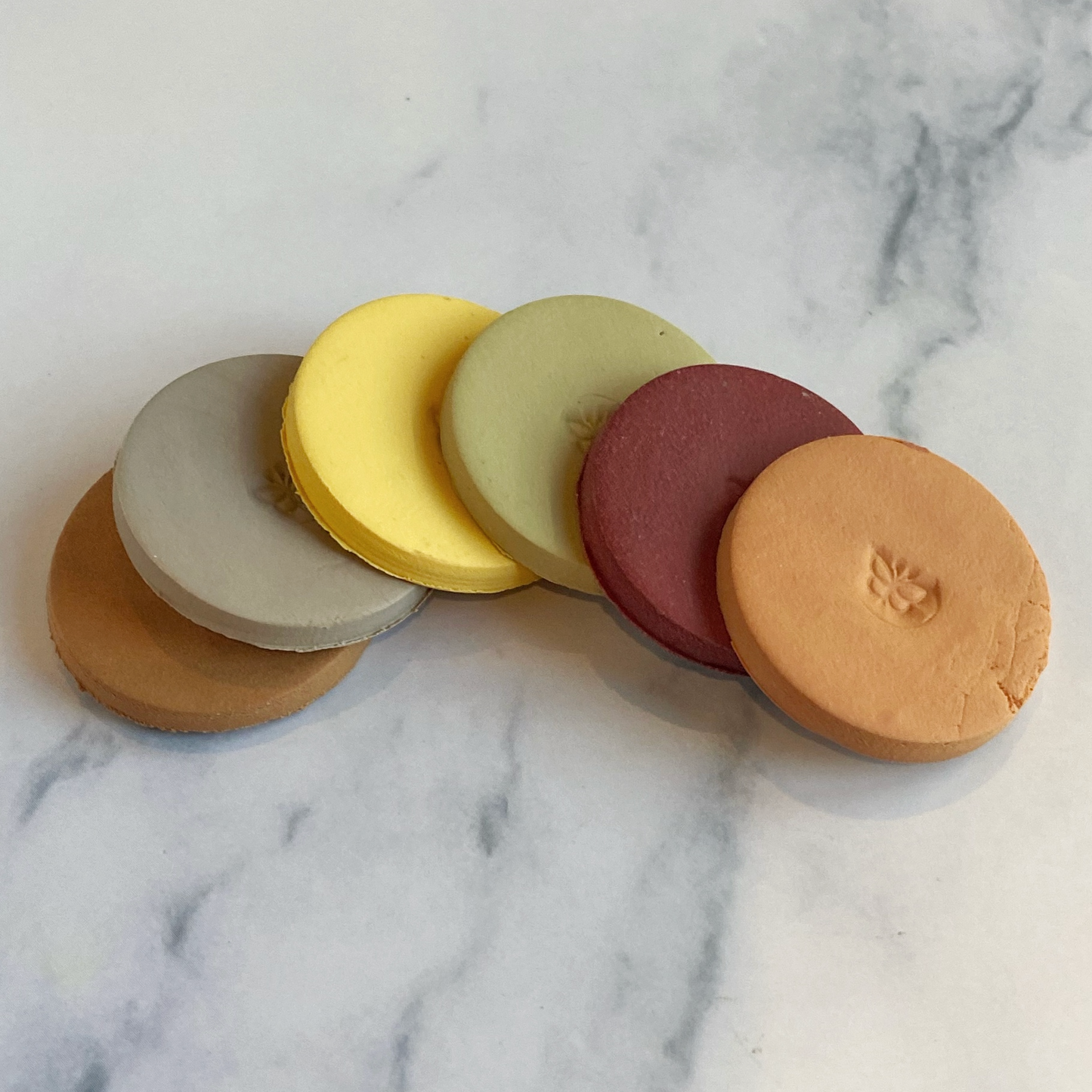 Sample Clay Color Discs arranged in an arc