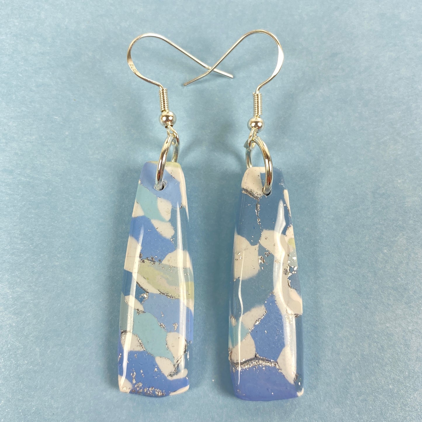 Moody Blues Handmade Polymer Clay Dangle Long Earrings front view blue background