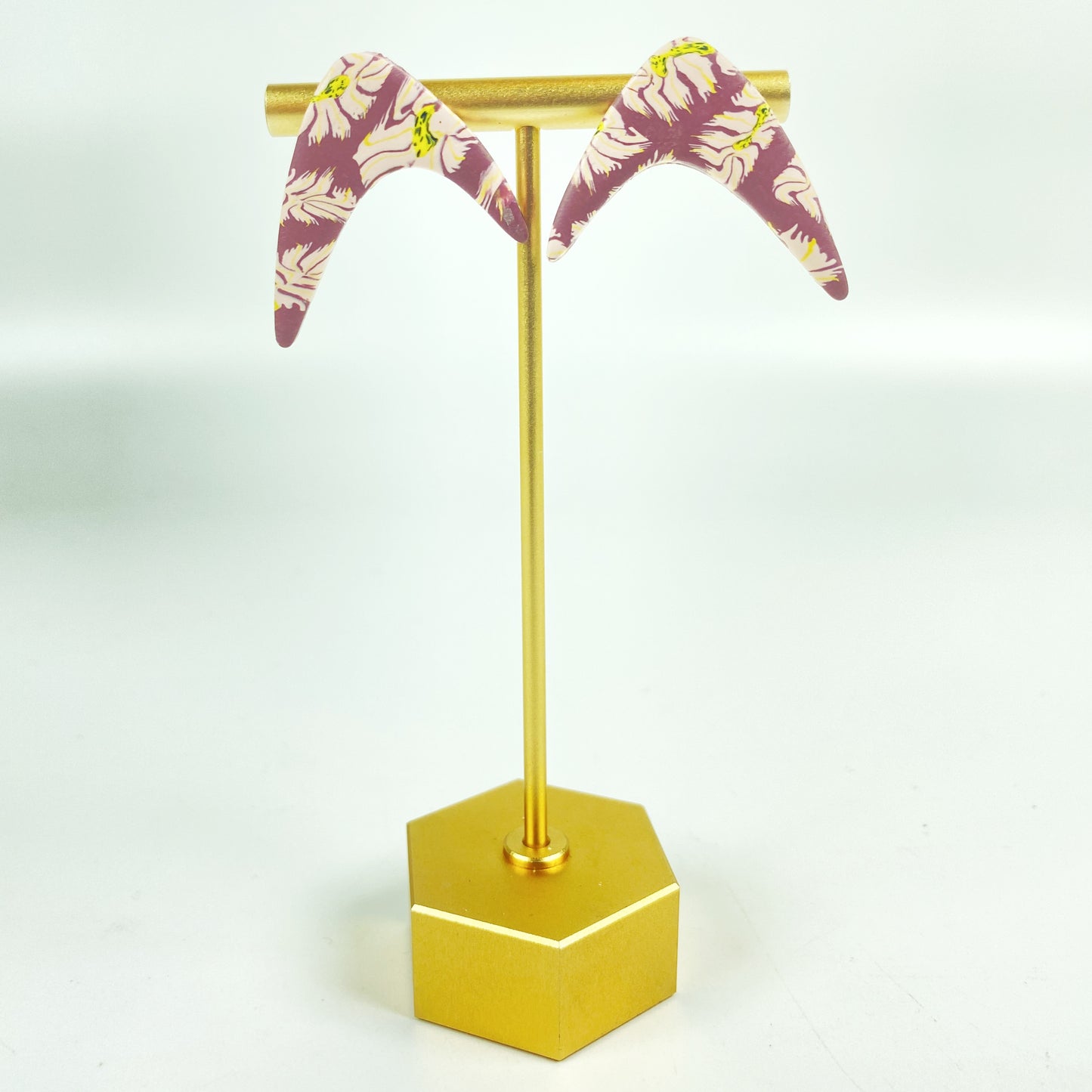 Exotic Blooms Handmade Polymer Clay Boomerang Earrings on brass display stand