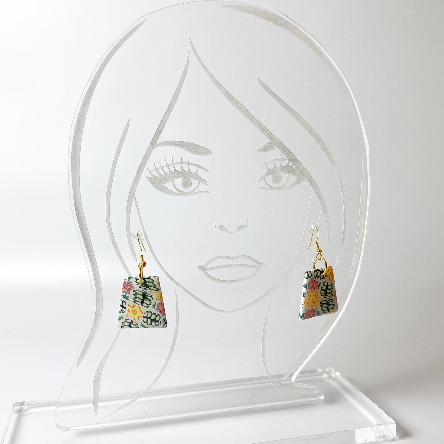 Blossom Burst Handmade Polymer Clay Dangle Earrings on acrylic display head