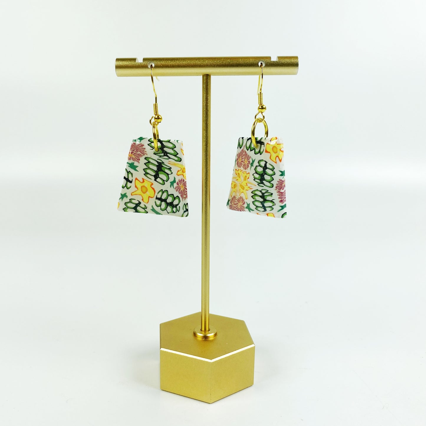 Blossom Burst Handmade Polymer Clay Dangle Earrings on brass display stand