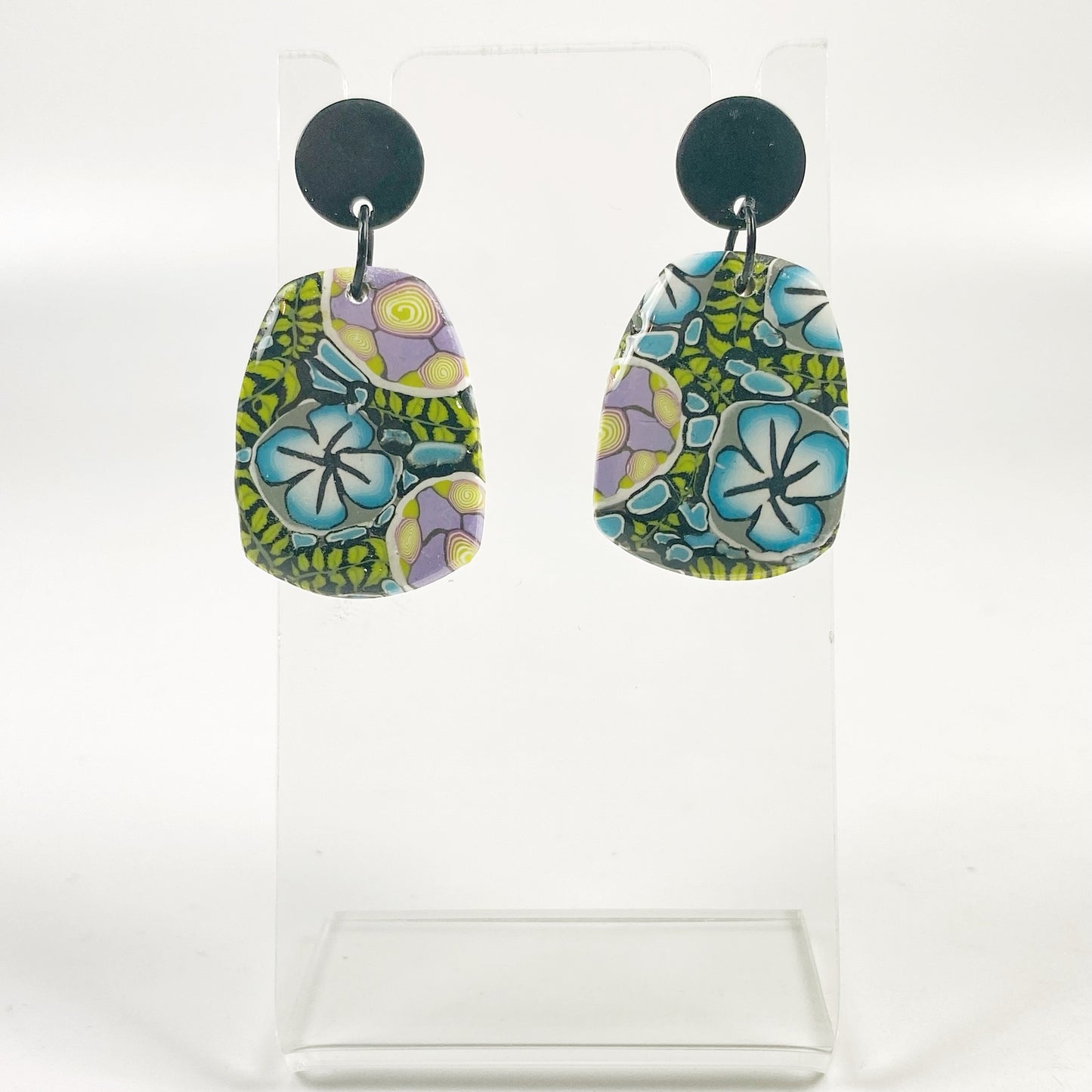 Twilight Blooms Earrings on a small acrylic display