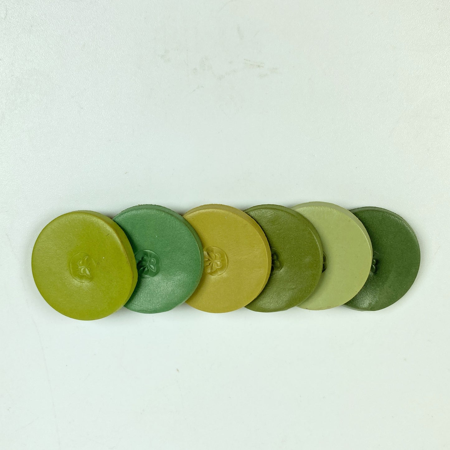 Winter Garden Palette Polymer Clay Color Mixing Tutorial clay color sample discs in a sideways stack