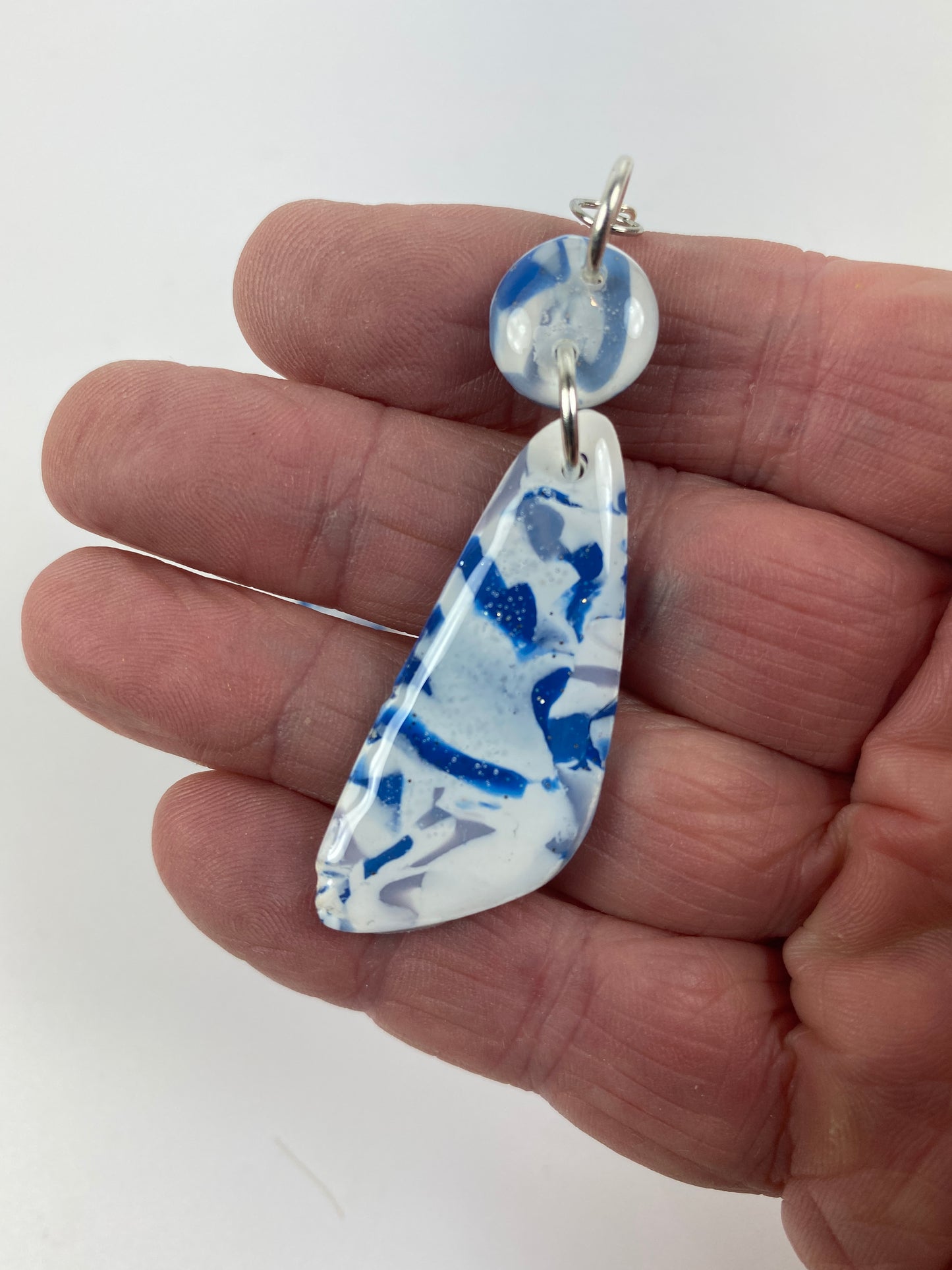 Blue Marble Handmade Polymer Clay Long Dangle Earrings hand held for size reference