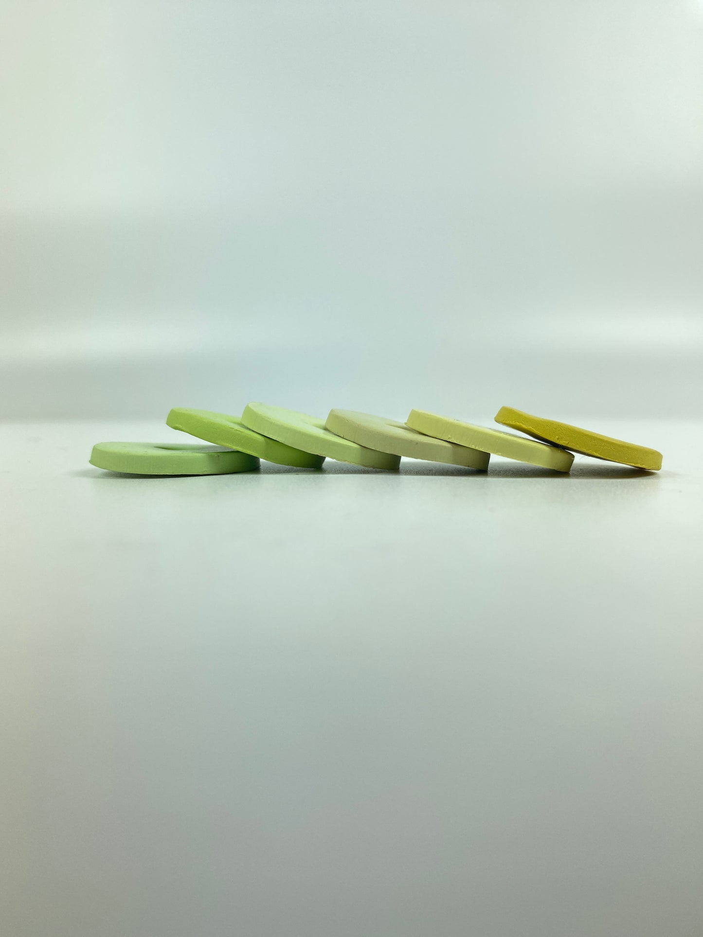 Polymer Clay Spring Greens 6 color palette sample discs in a stacked line