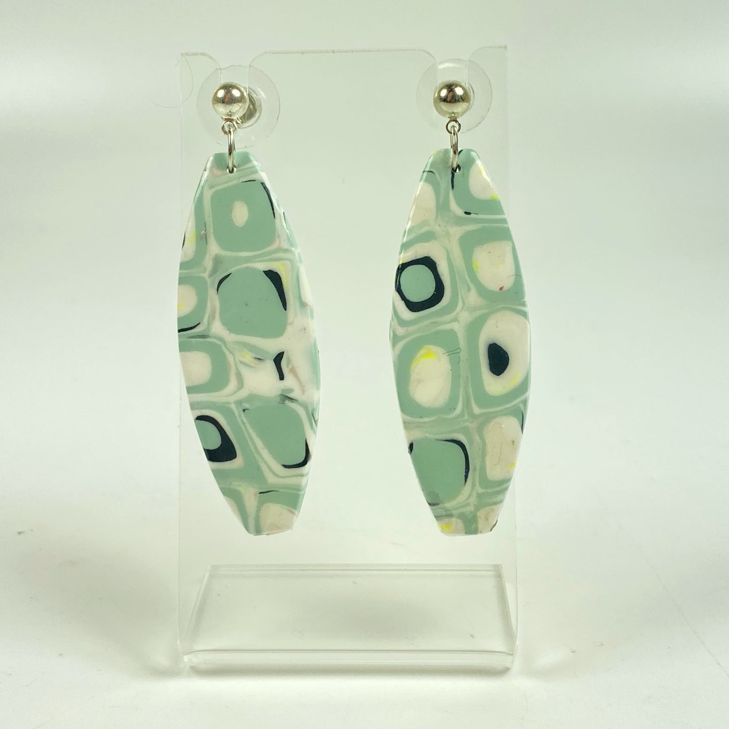 Dreamy Mint Noir Earrings on a small acrylic display stand