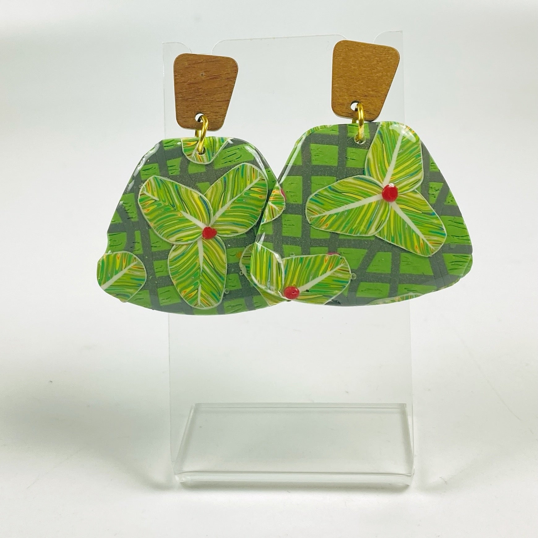 Jungle Canopy Earrings on a small acrylic display