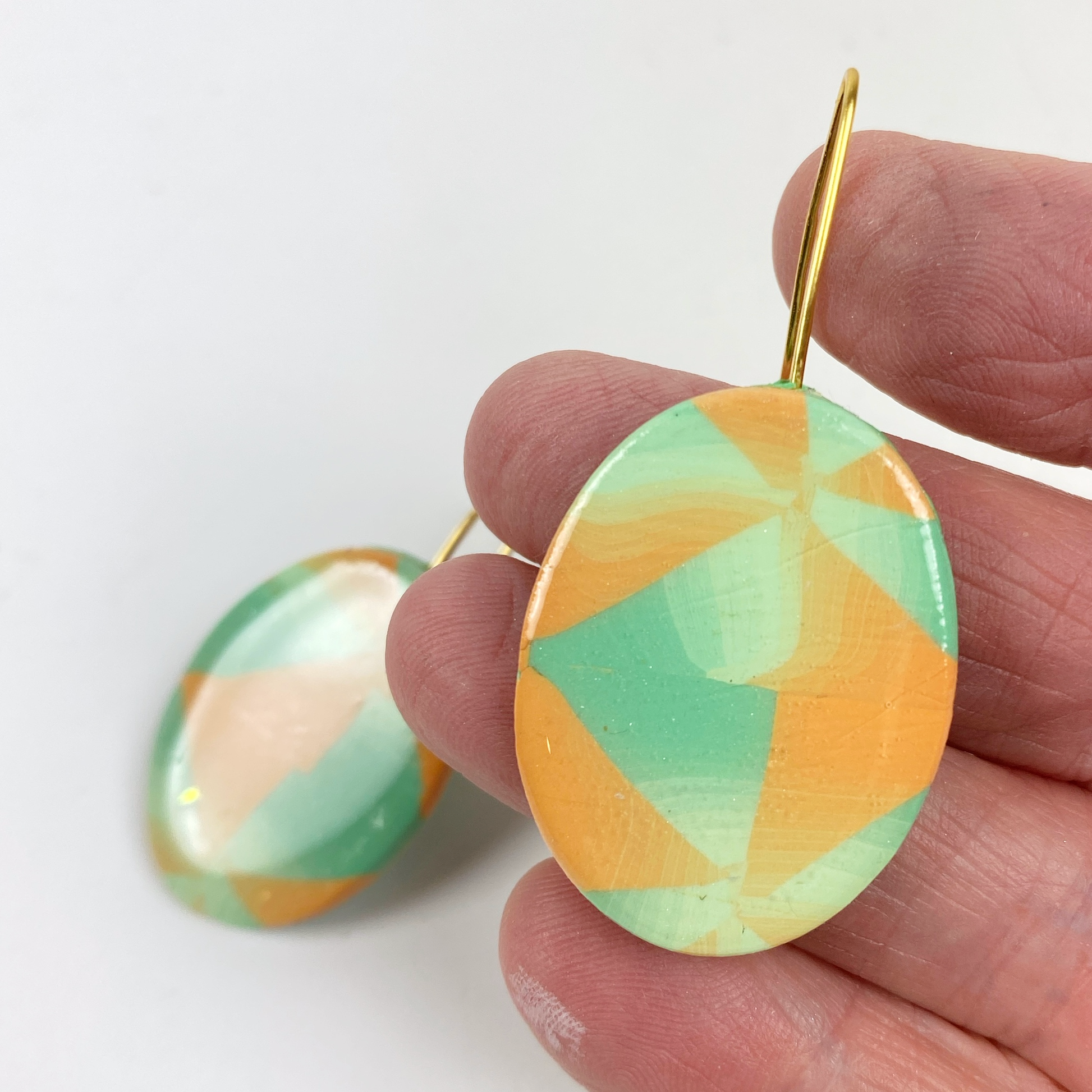 Sage & Terracotta Handmade Polymer Clay Dangle Earrings handheld for size reference