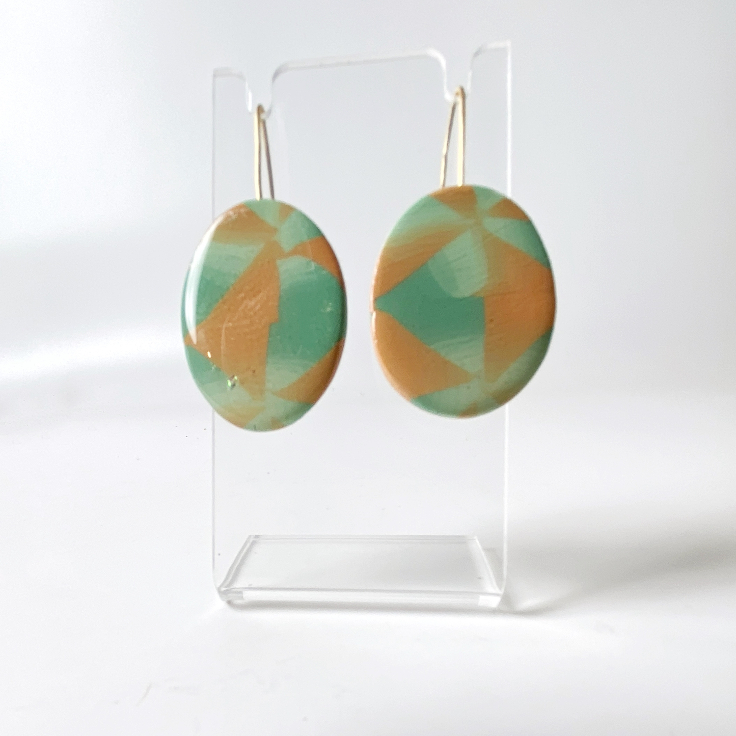 Sage & Terracotta Handmade Polymer Clay Dangle Earrings on small acrylic stand