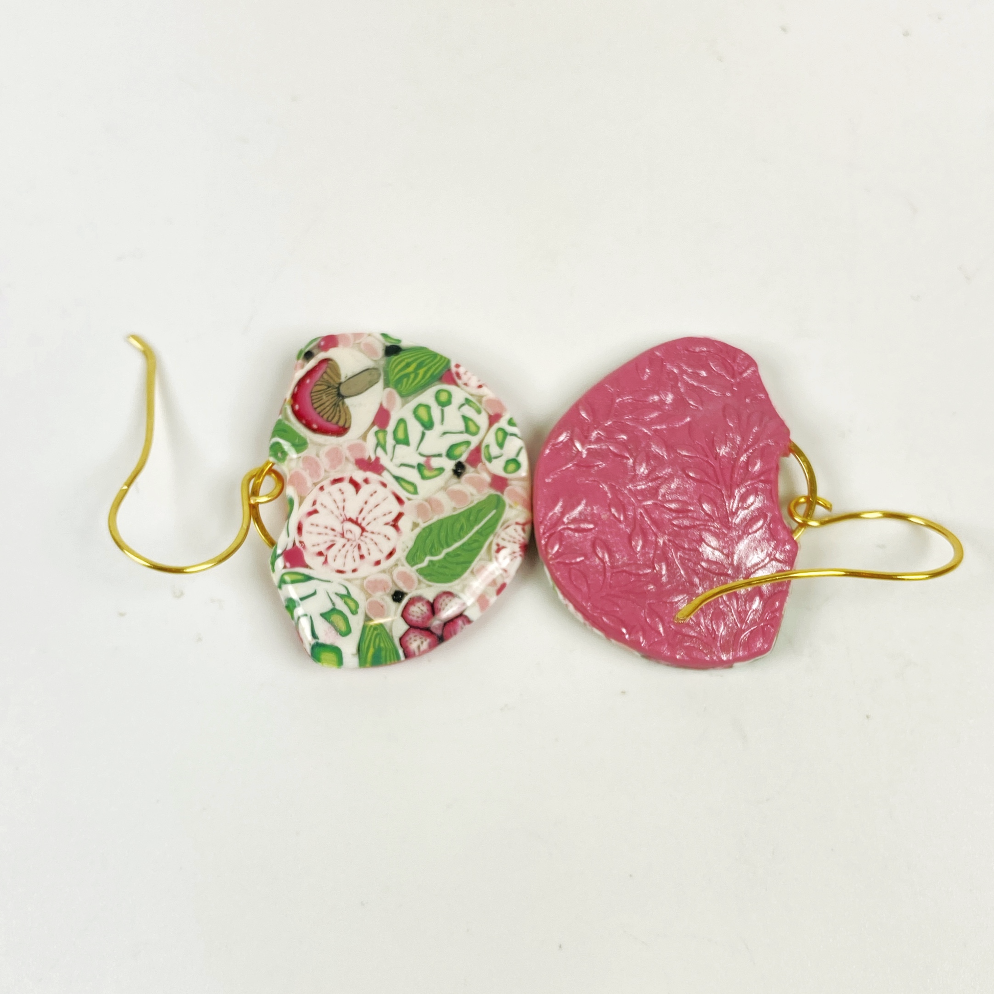 Pink Woodlands Handmade Polymer Clay Dangle Earrings showing the embossed deep pink background