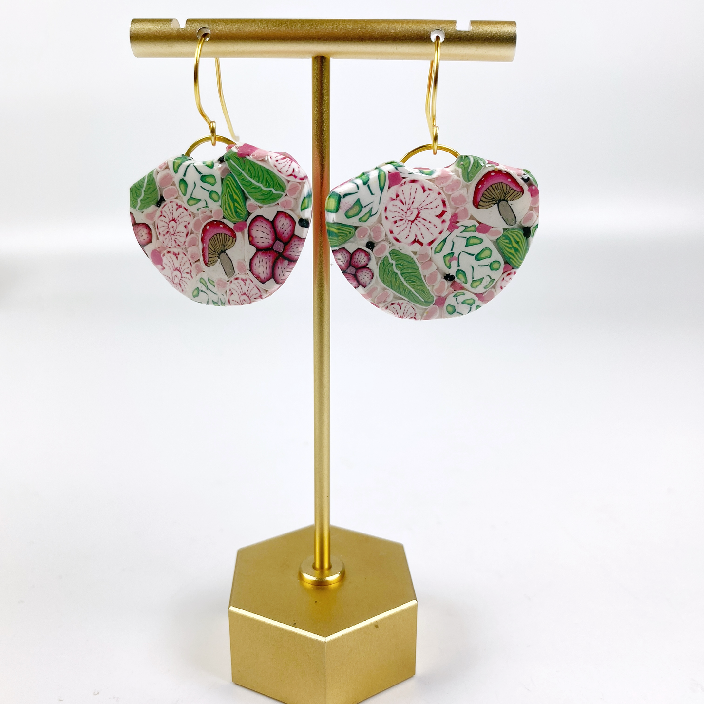Pink Woodlands Handmade Polymer Clay Dangle Earrings on brass display stand