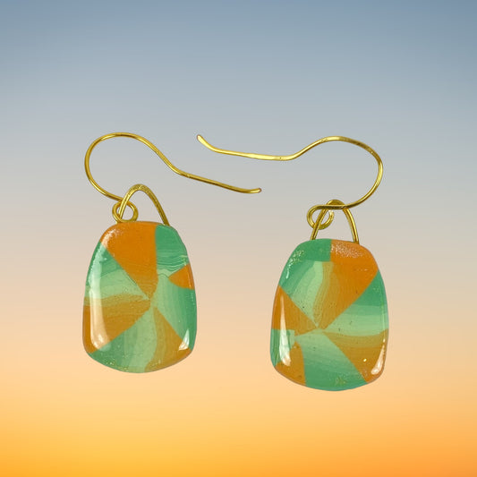 Desert Trapezoid Handmade Polymer Clay Earrings on a gentle sunset background