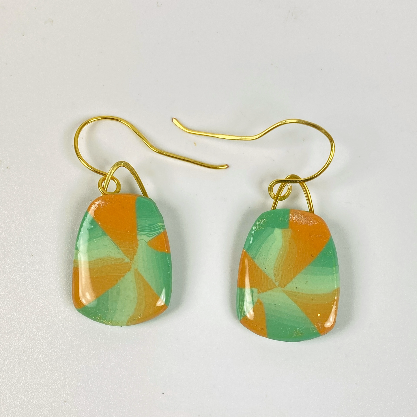 Desert Trapezoid Handmade Polymer Clay Earrings on a neutral background