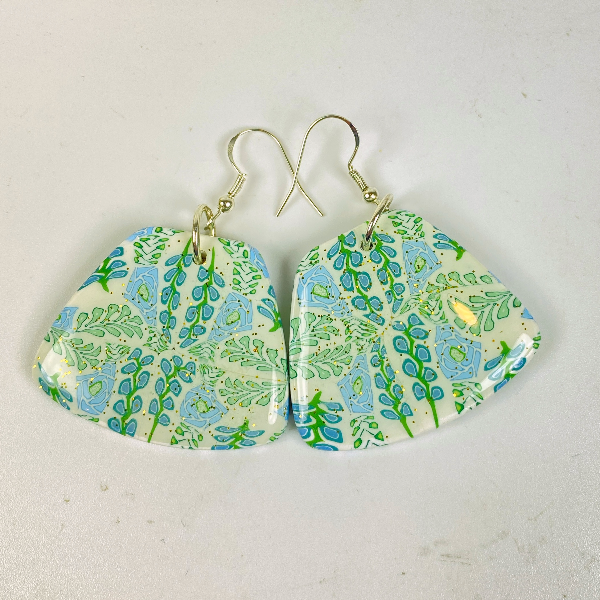 Blue Blossom Handmade Polymer Clay Trapezoid Earrings on a white background