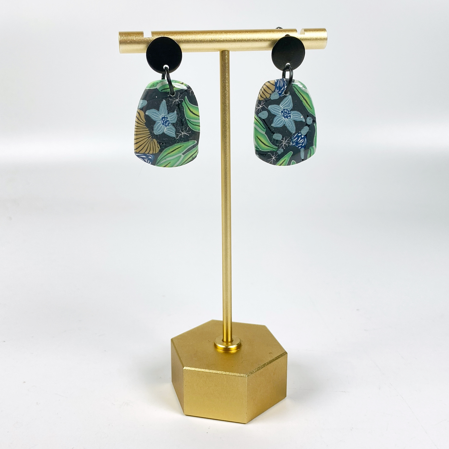 Blue Blossom Handmade Polymer Clay Earrrings on a brass earring stand