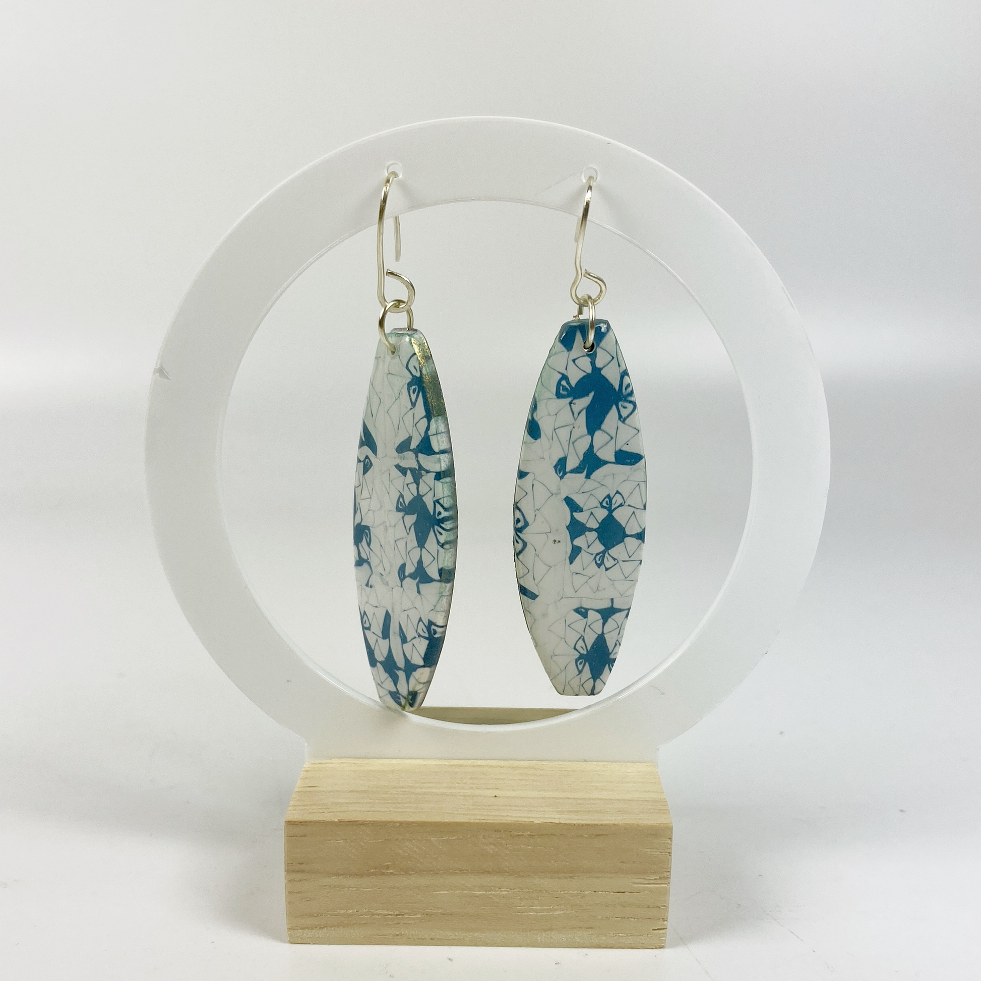 Denim Chic Handmade Polymer Clay Dangle Earrings on an earrings display stand