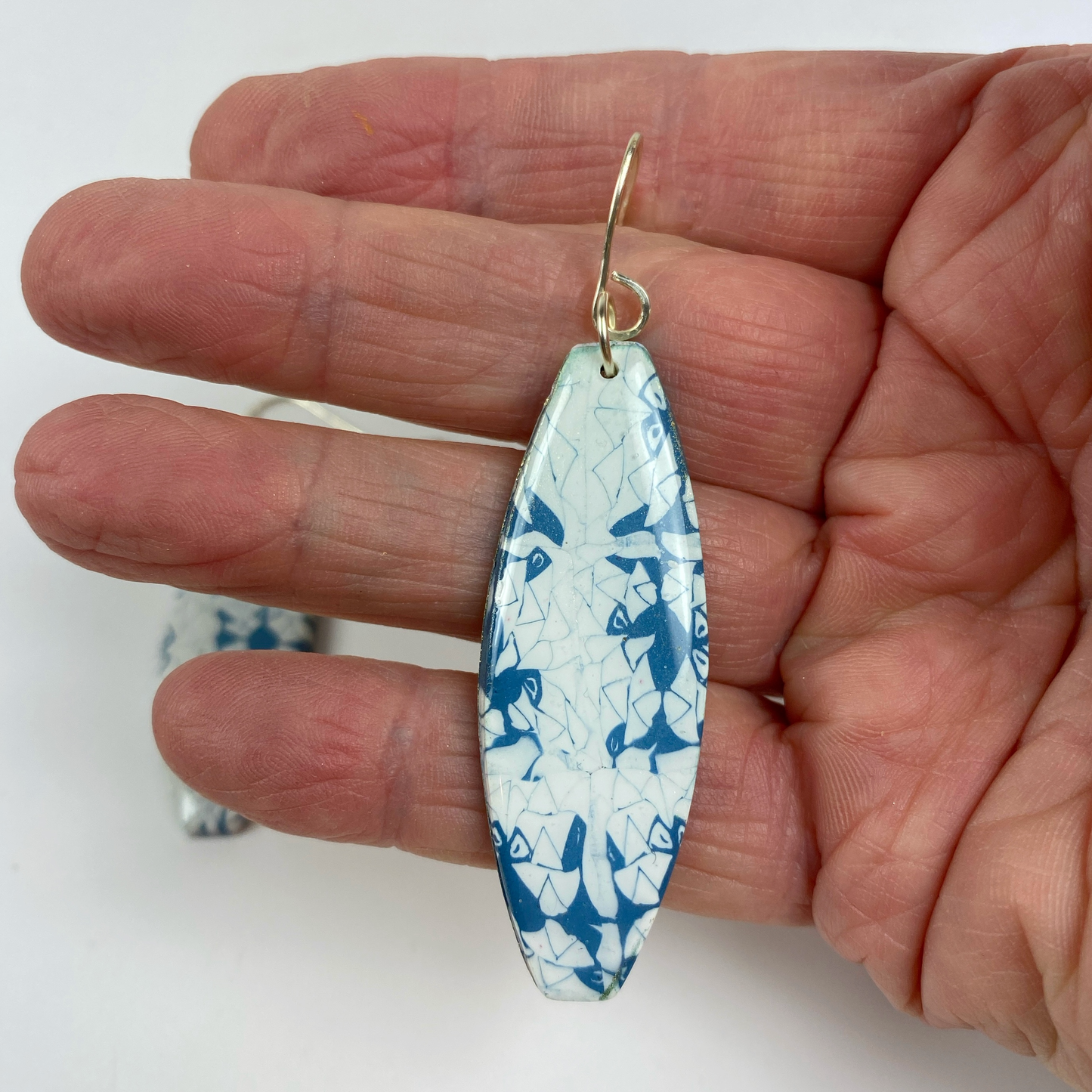 Denim Chic Handmade Polymer Clay Dangle Earrings hand held for size reference