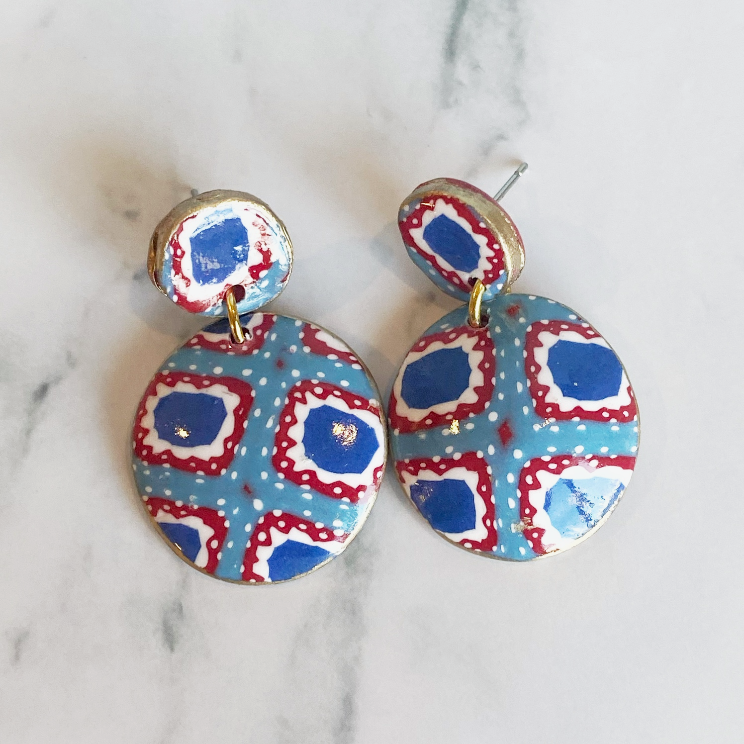 Handmade Polymer Clay Bandana Dangle Earrings on a plain background