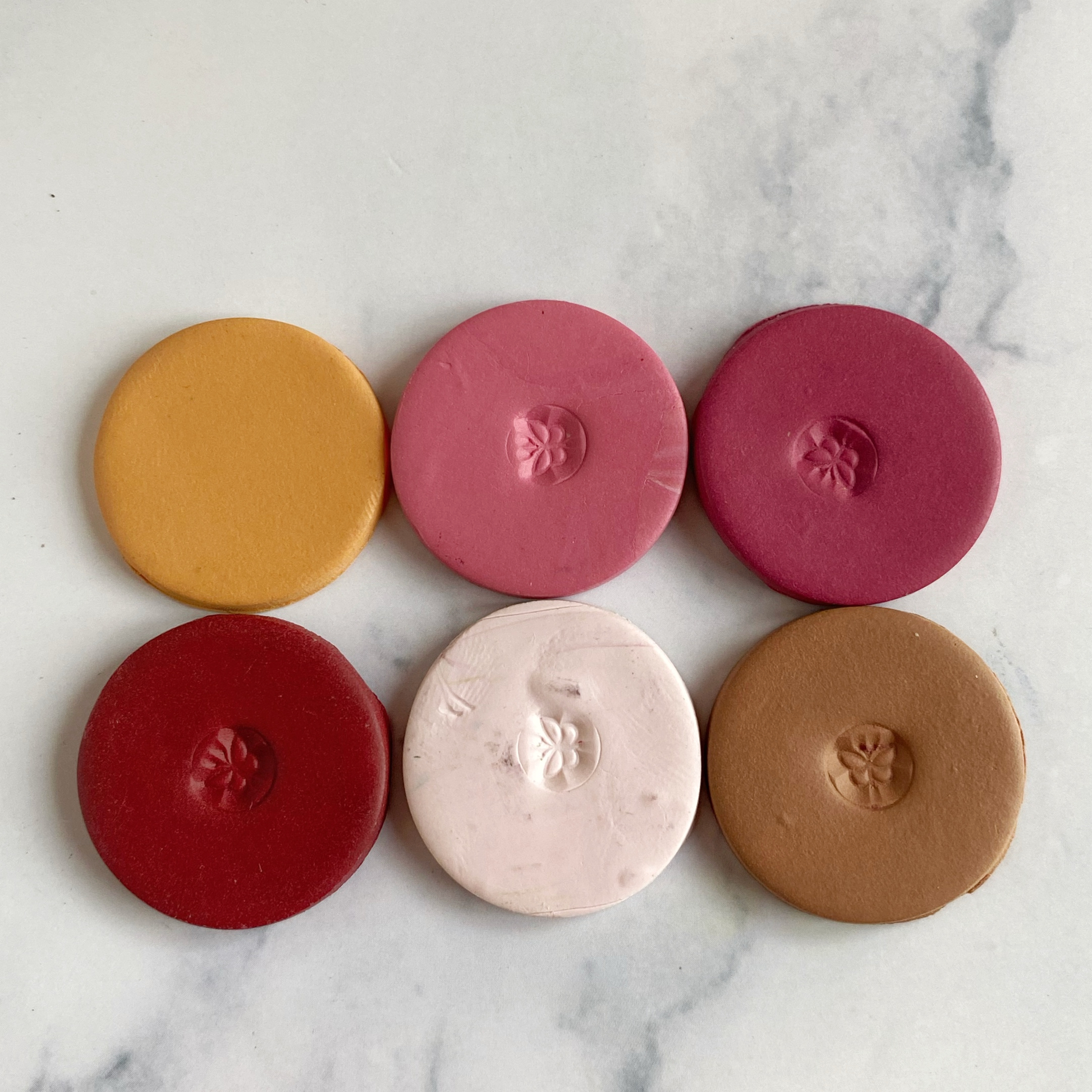 sample clay discs in the six colors of this palette laid out in a 2 x 3 grid