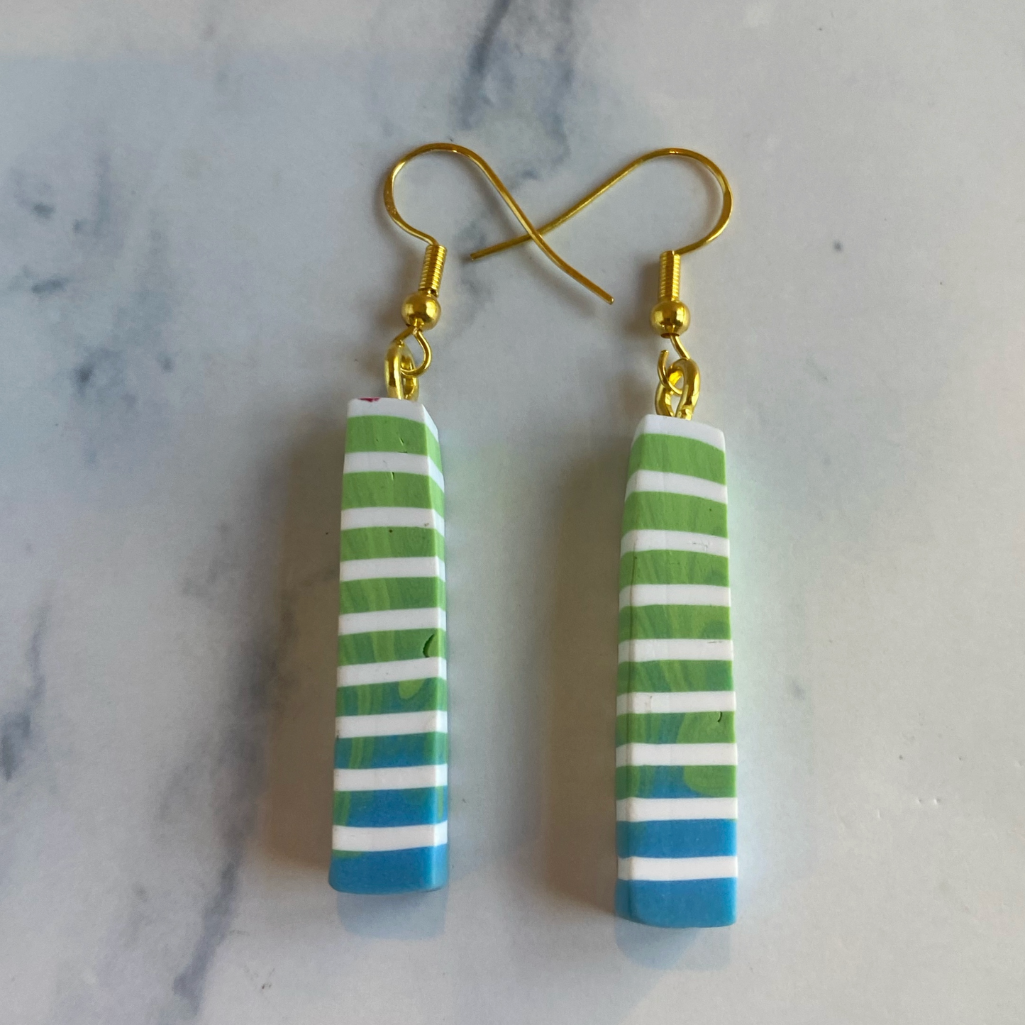 Blue Green and White Polymer Clay Column Earrings on marble