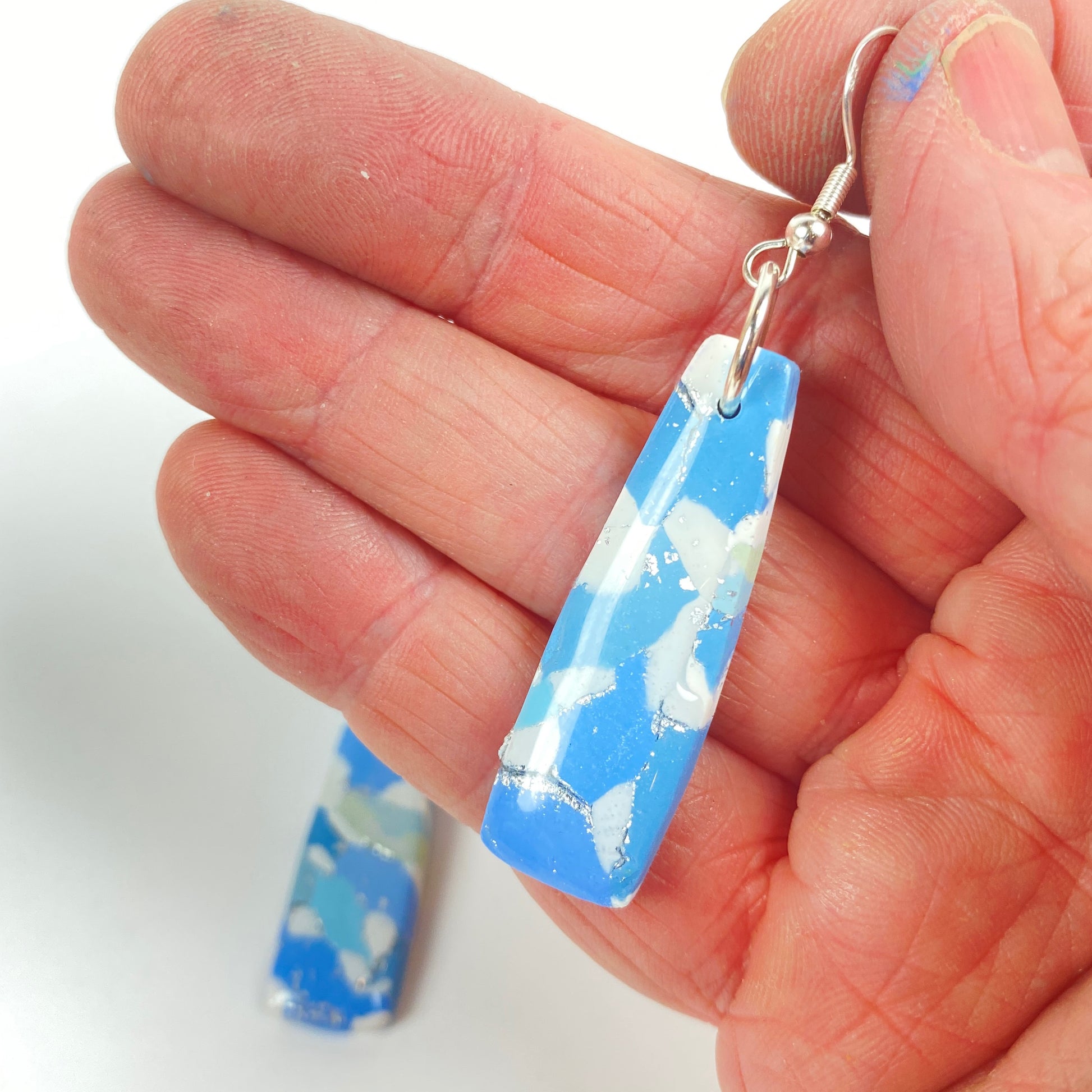 Moody Blues Handmade Polymer Clay Dangle Long Earrings handheld for size reference