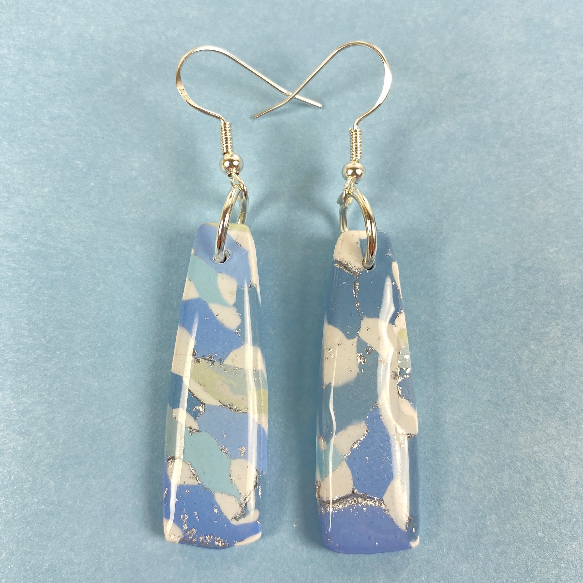 Moody Blues Handmade Polymer Clay Dangle Long Earrings front view blue background