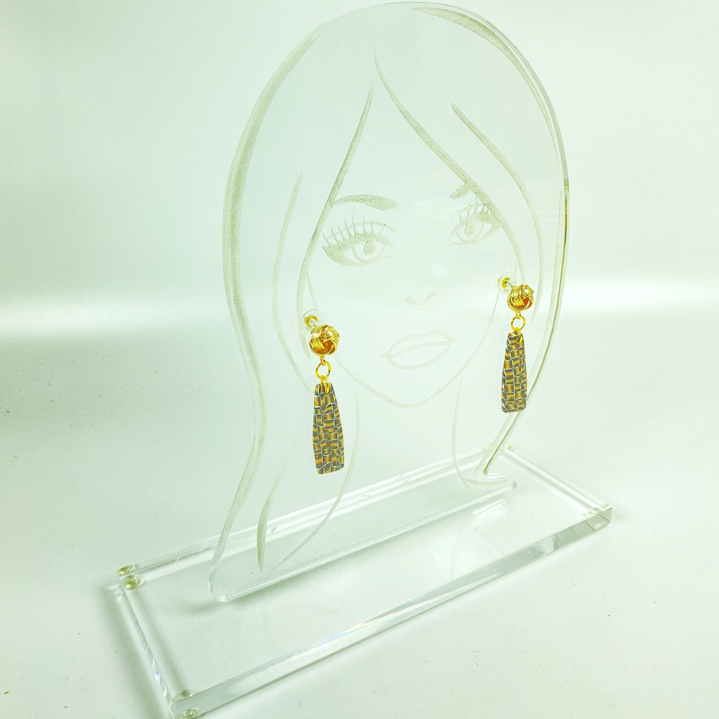 On a clear acrylic display stand