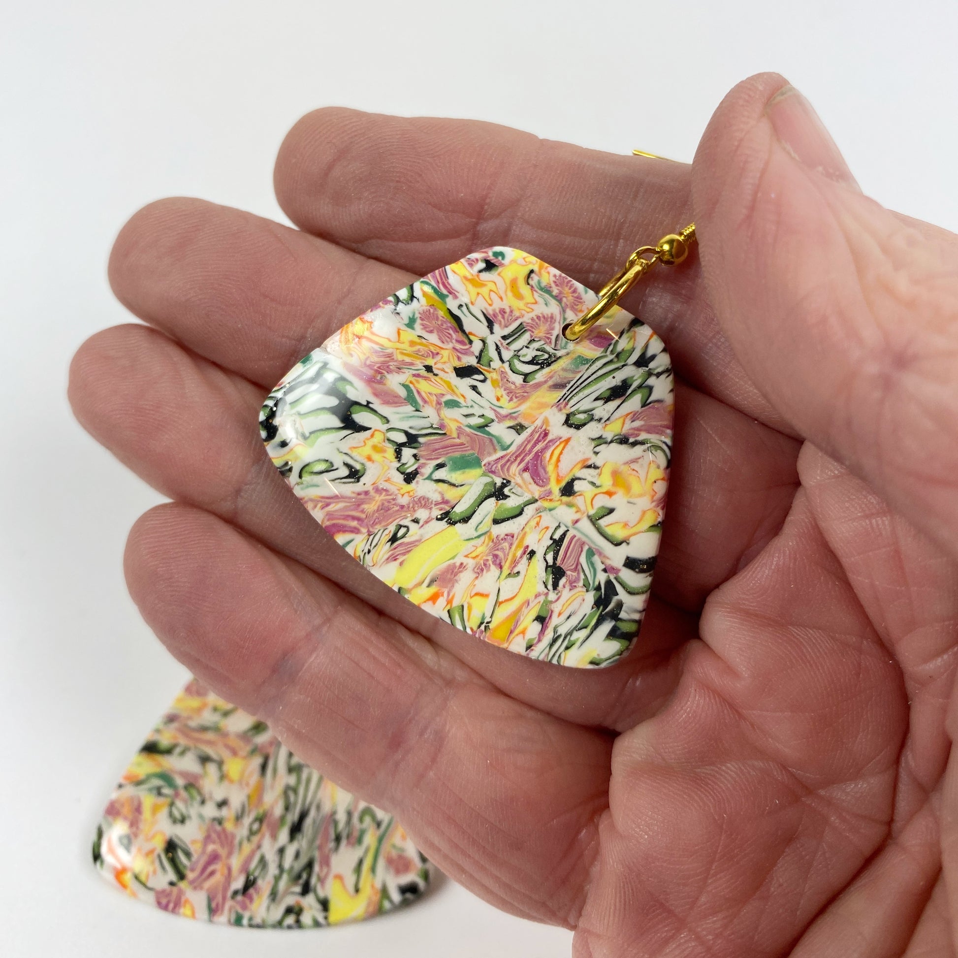 Garden Marbled Handmade Polymer Clay Dangle Earrings handheld for size reference