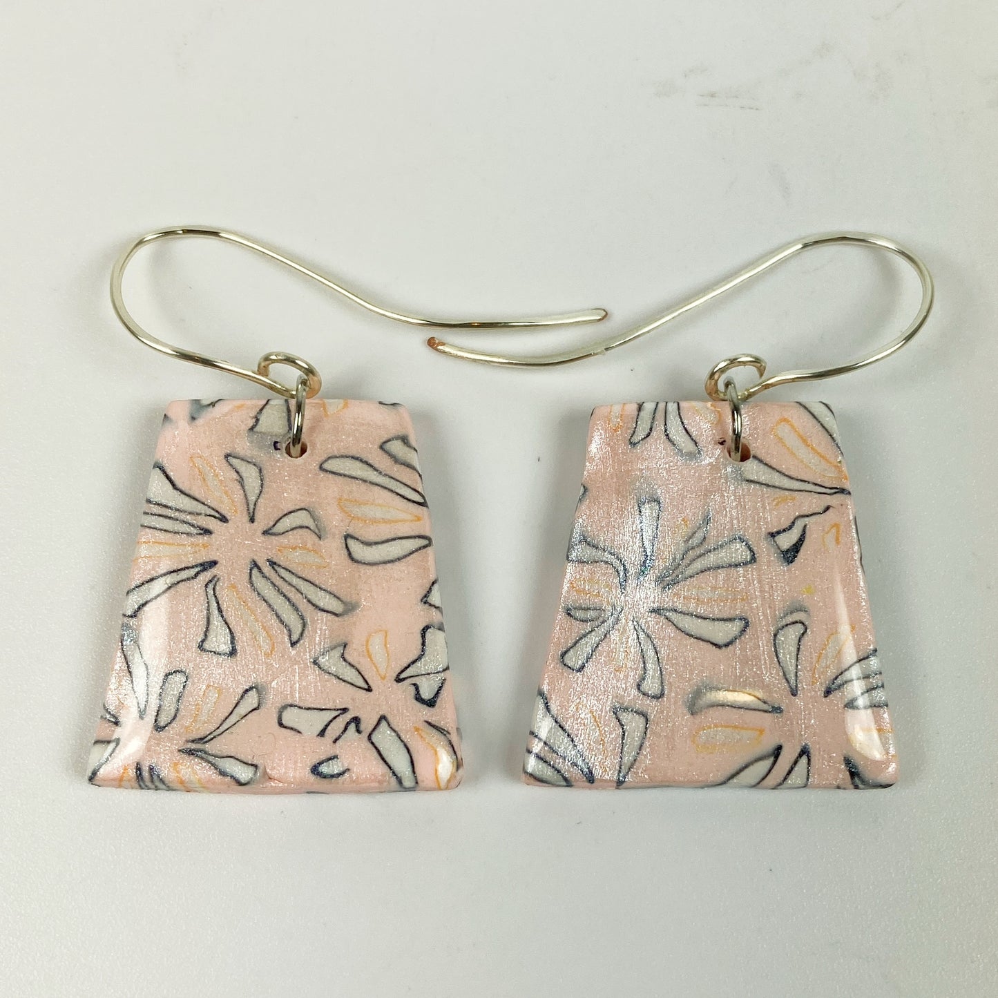Polymer Clay Handmade Pink Dangle Earrings on a neutral background