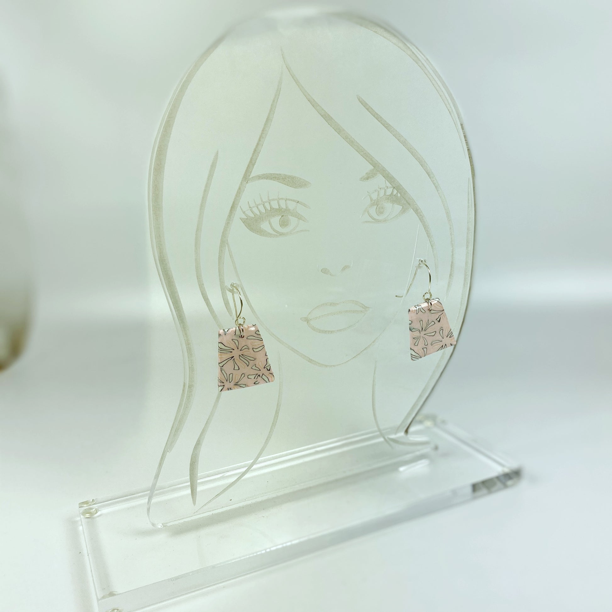 Polymer Clay Handmade Pink Dangle Earrings on an acrylic display head