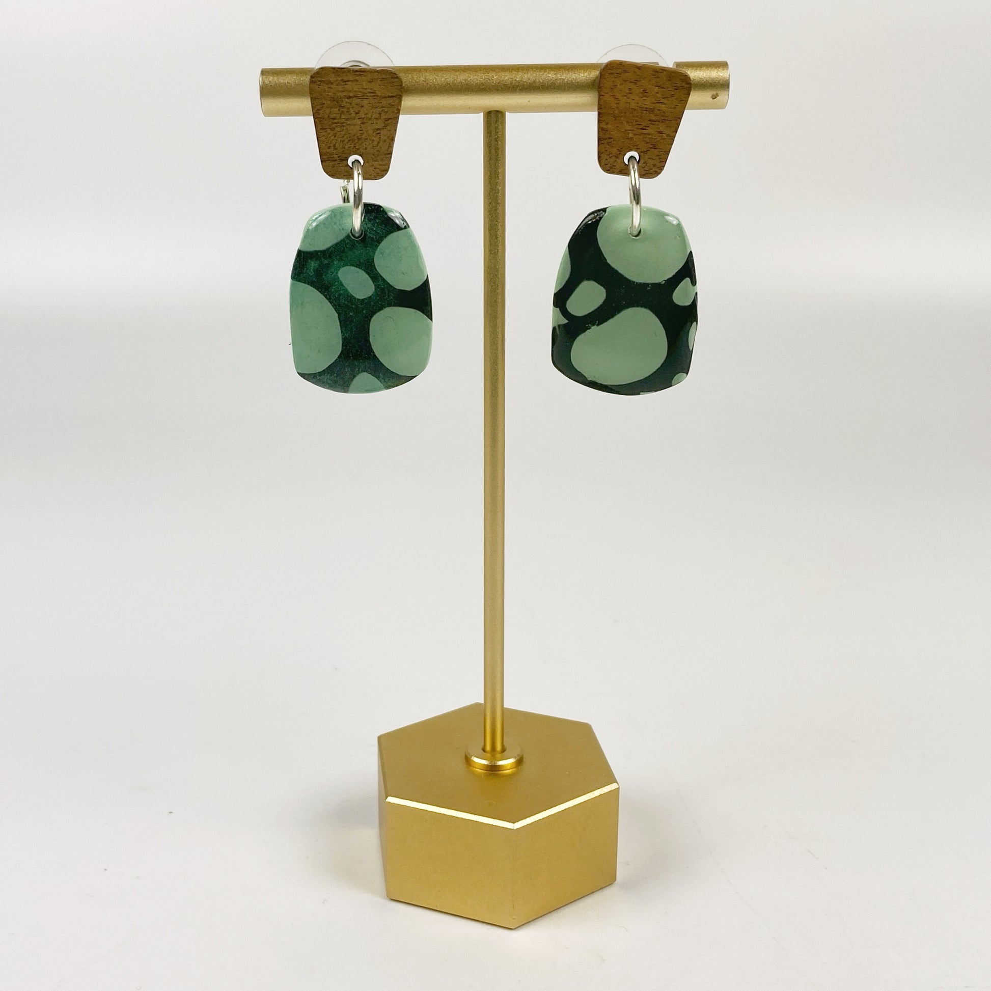 Midnight Forest Handmade Polymer Clay Dangle Earrings on a brass earring stand