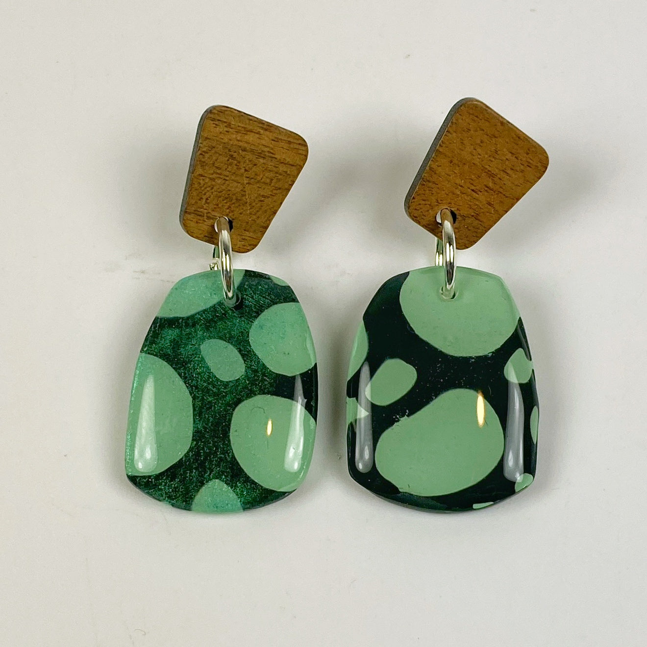 Midnight Forest Handmade Polymer Clay Dangle Earrings on a neutral background