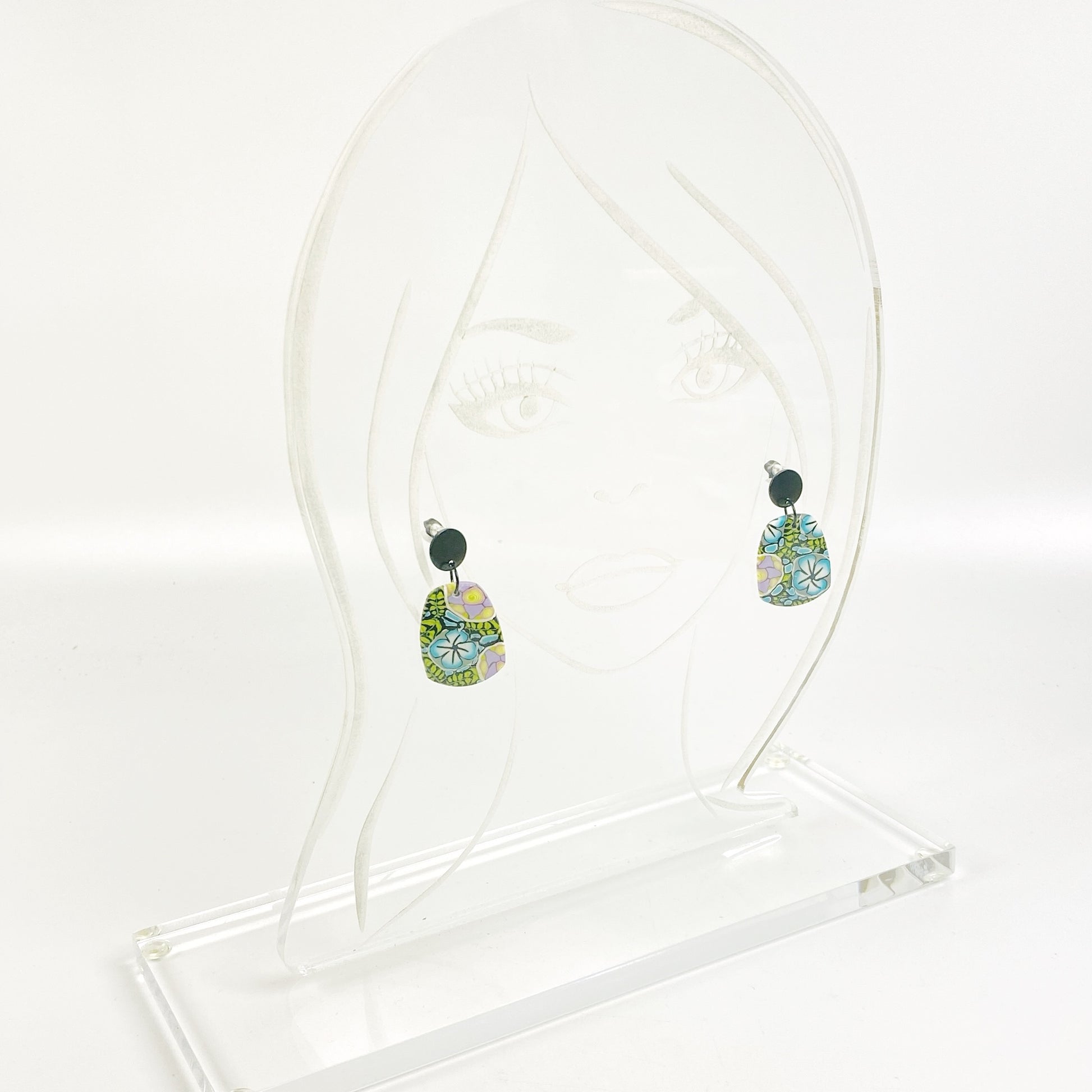 Twilight Blooms Earrings on an acrylic display stand