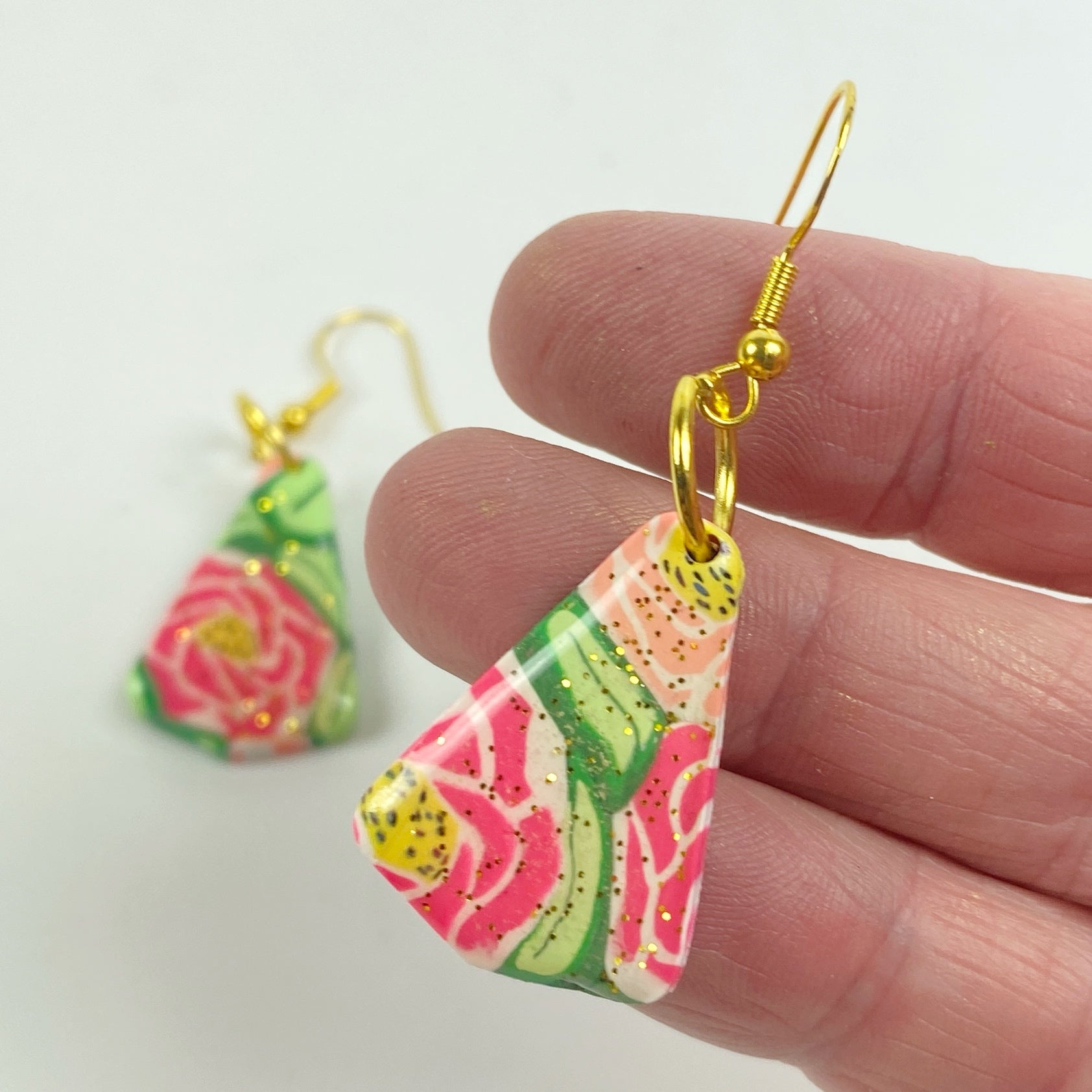 Whispering Roses Handmade Polymer Clay Dangle Earrings handheld for size reference