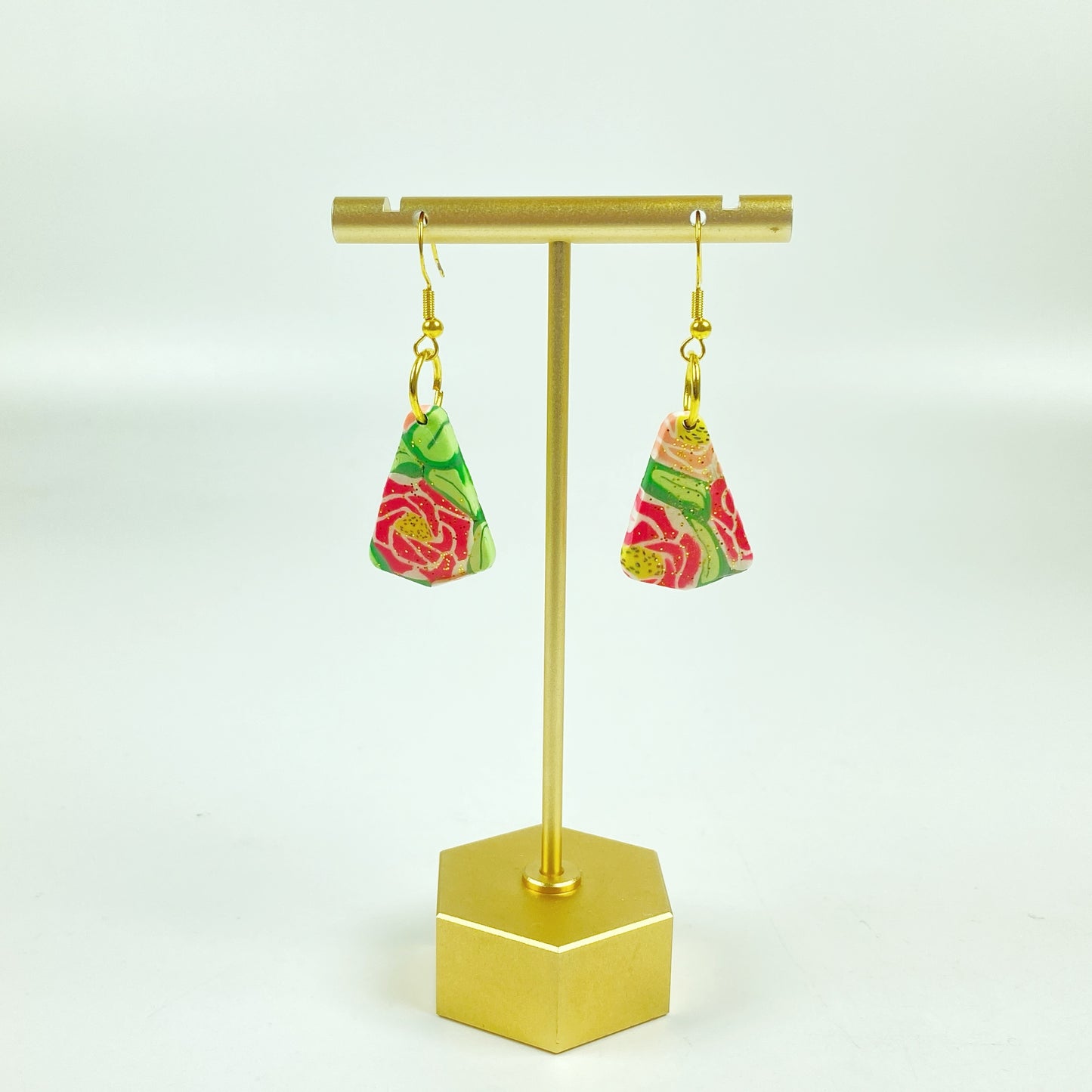 Whispering Roses Handmade Polymer Clay Dangle Earrings on a brass earring stand