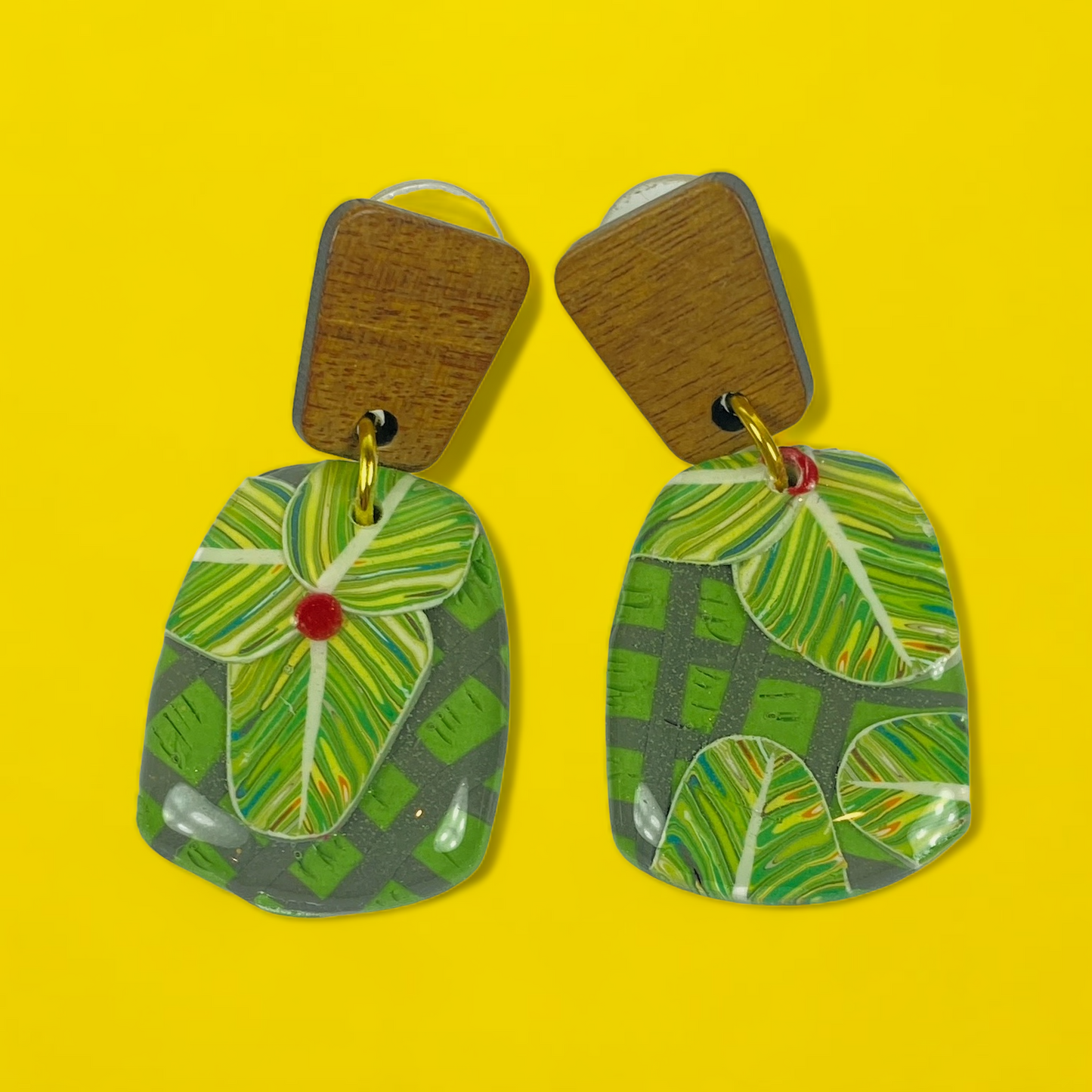Jungle Canopy Handmade Polymer Clay Dangle Earrings on a bright yellow background