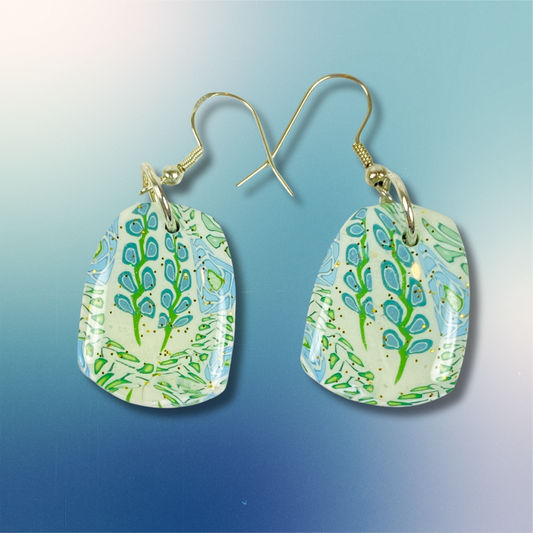 Blue Blossom Handmade Polymer Clay Dangle Earrings on a blue gradient background