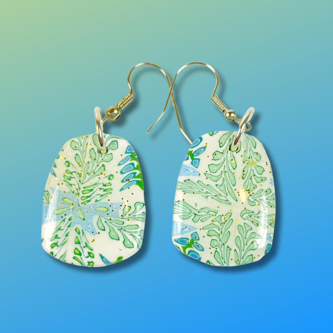 Blue Blossom Handmade Polymer Clay Pendent Earrings on blue gradient background