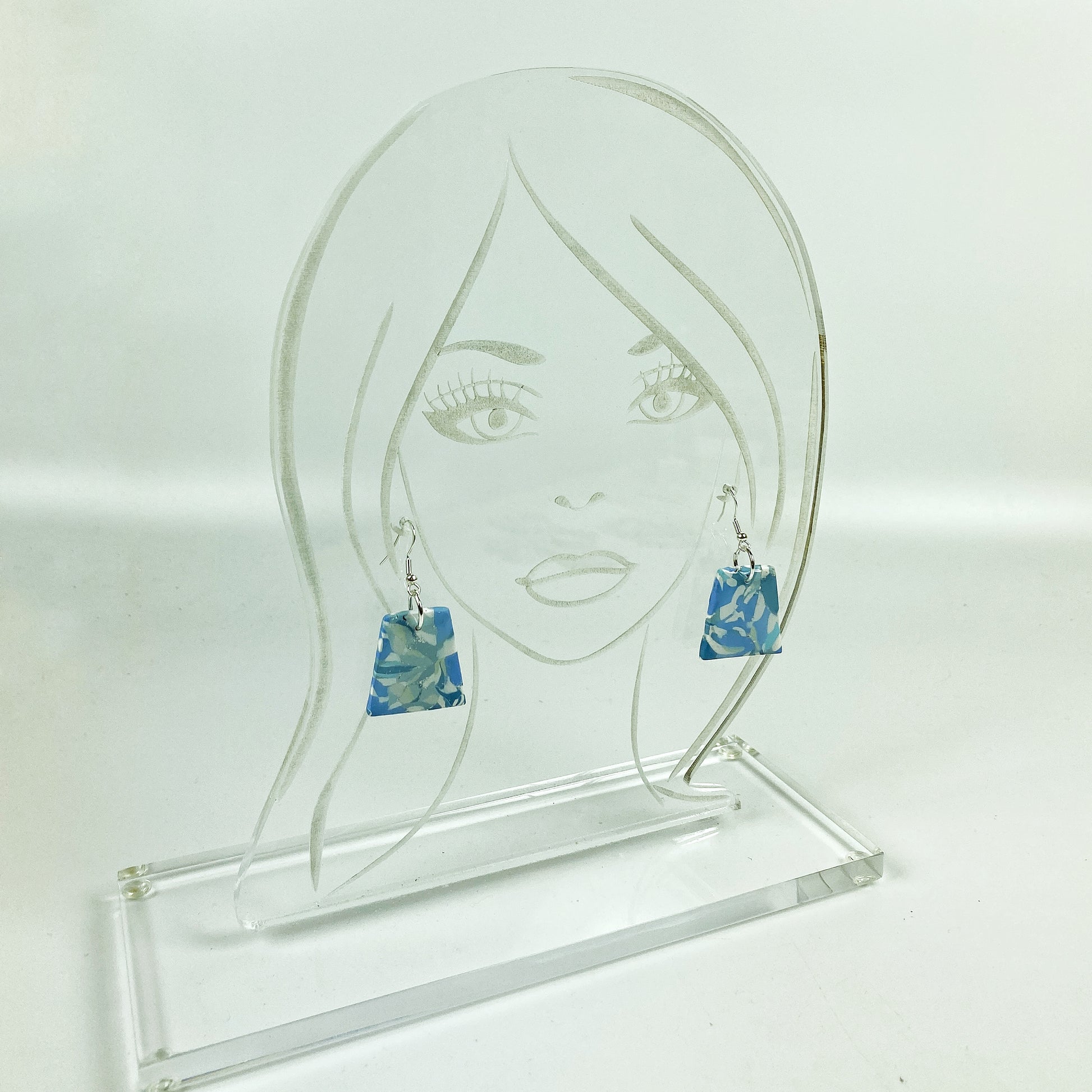 Moody Blue Handmade Polymer Clay Dangle Trapezoid Earrings on acrylic display head