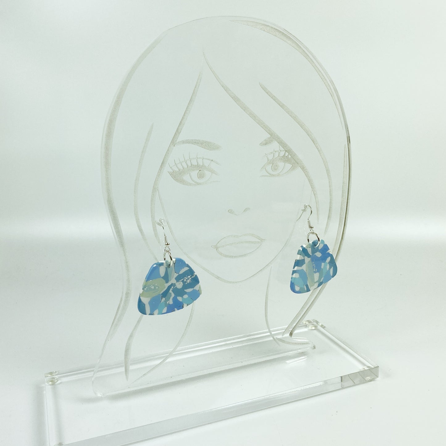 Moody Blue Handmade Polymer Clay Dangle Sleek Symmetry Earrings on acrylic display head