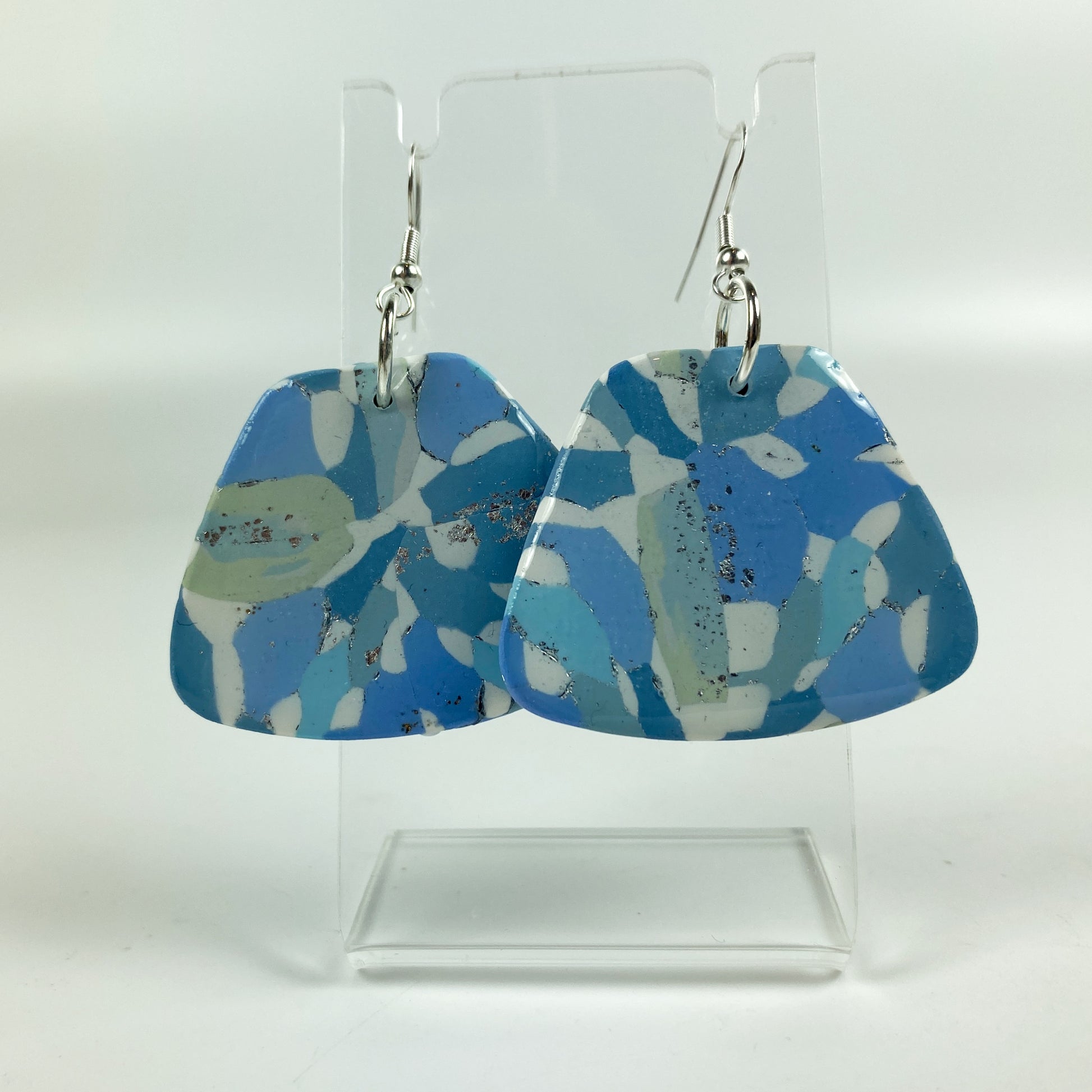Moody Blue Handmade Polymer Clay Dangle Sleek Symmetry Earrings on acrylic display stand