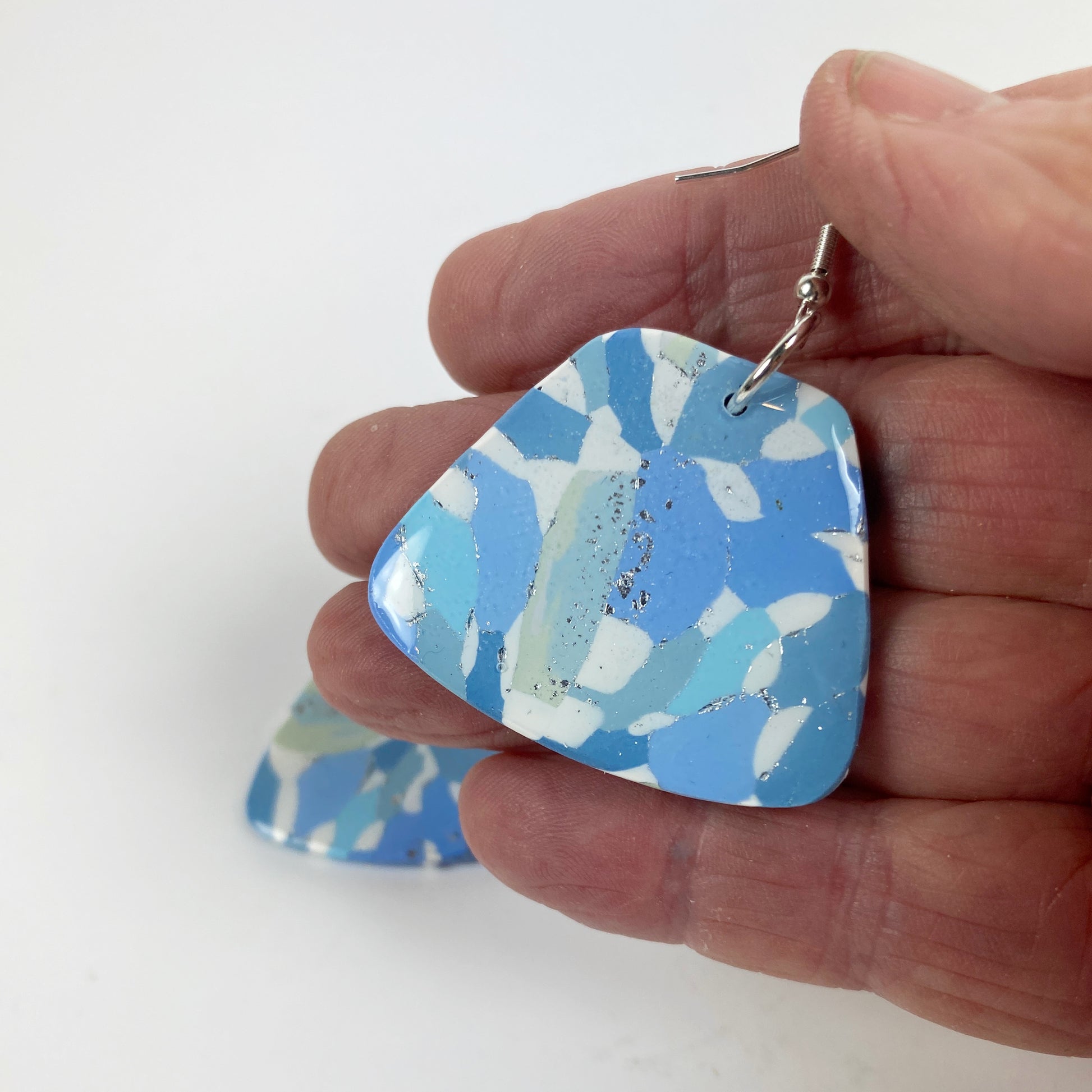 Moody Blue Handmade Polymer Clay Dangle Sleek Symmetry Earrings handheld for size reference