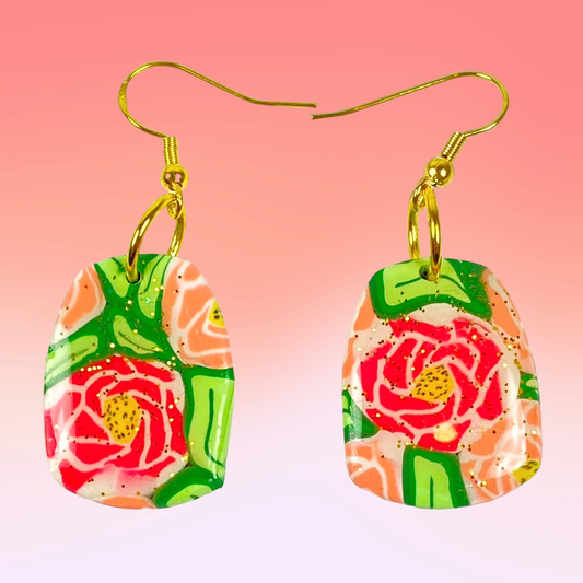 The Roses Handmade Polymer Clay Dangle Earrings on graduated pink backgroune
