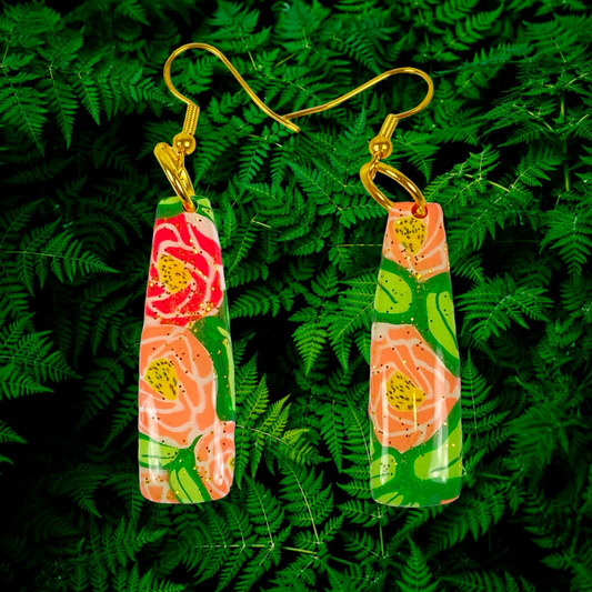 Rose Garden Handmade Polymer Clay Dangle Earrings on a leafy background