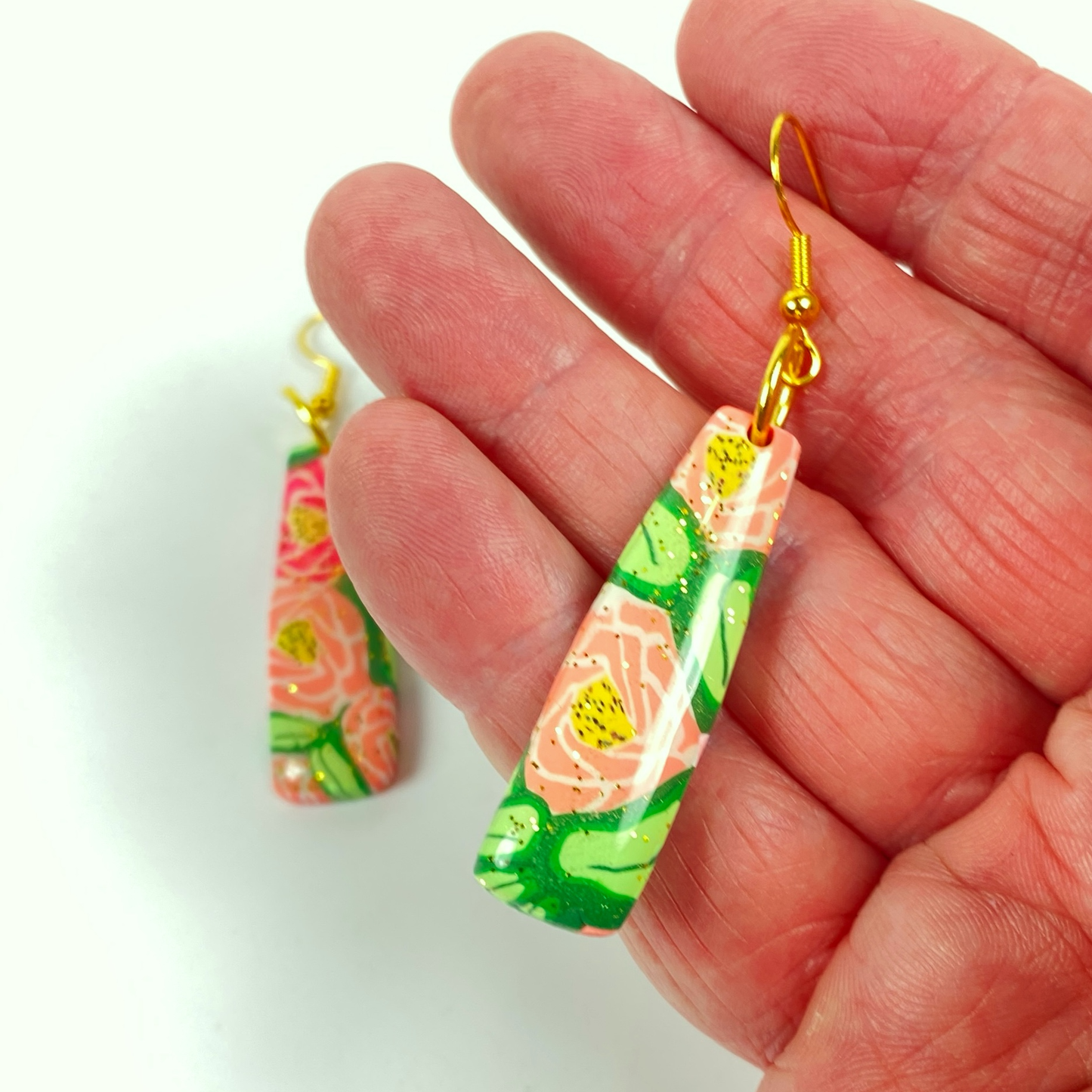 Rose Garden Handmade Polymer Clay Dangle Earrings handheld for size reference