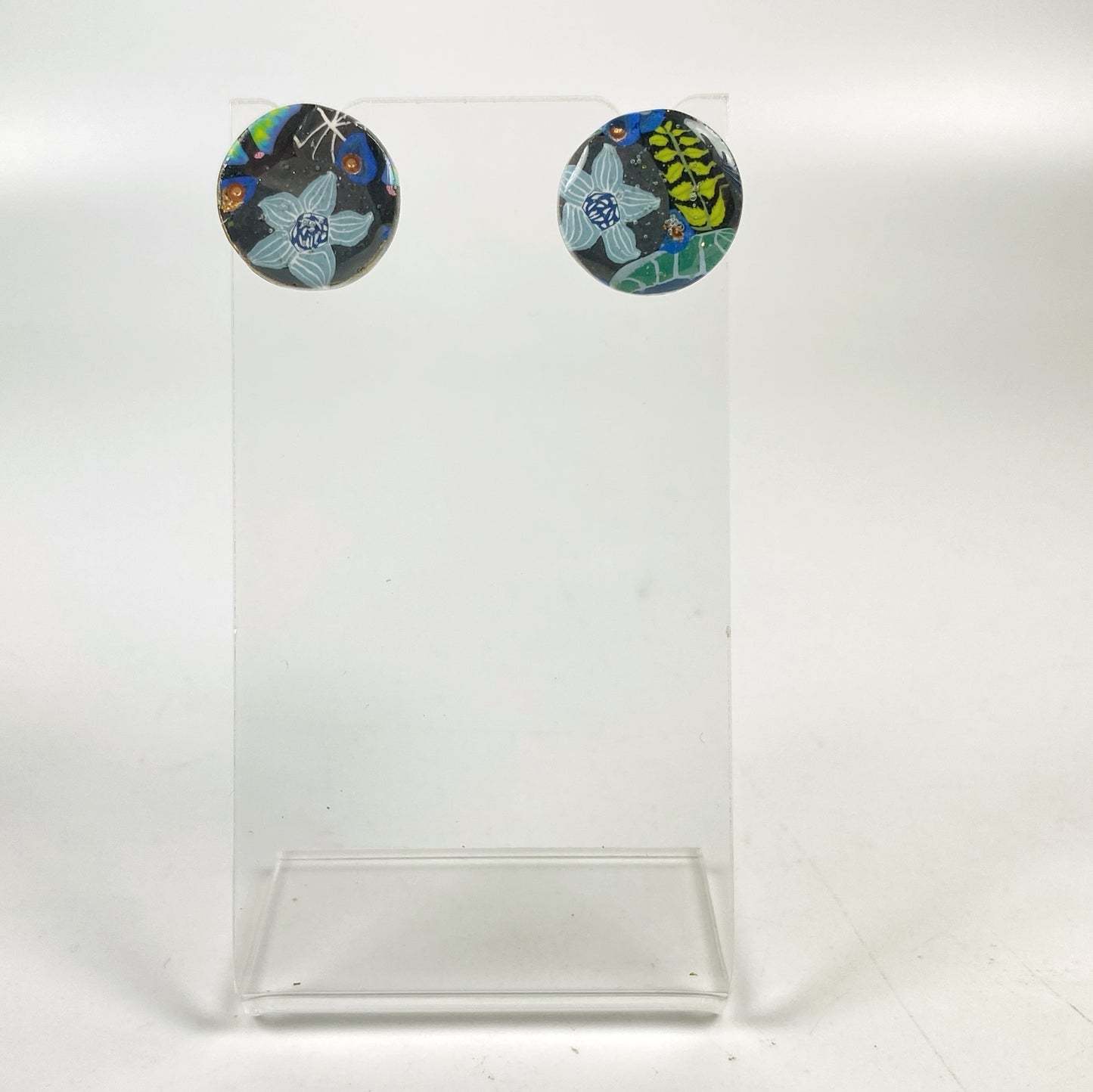 Blue Blossom Handmade Polymer Clay Stud Earrings on an acrylic stand