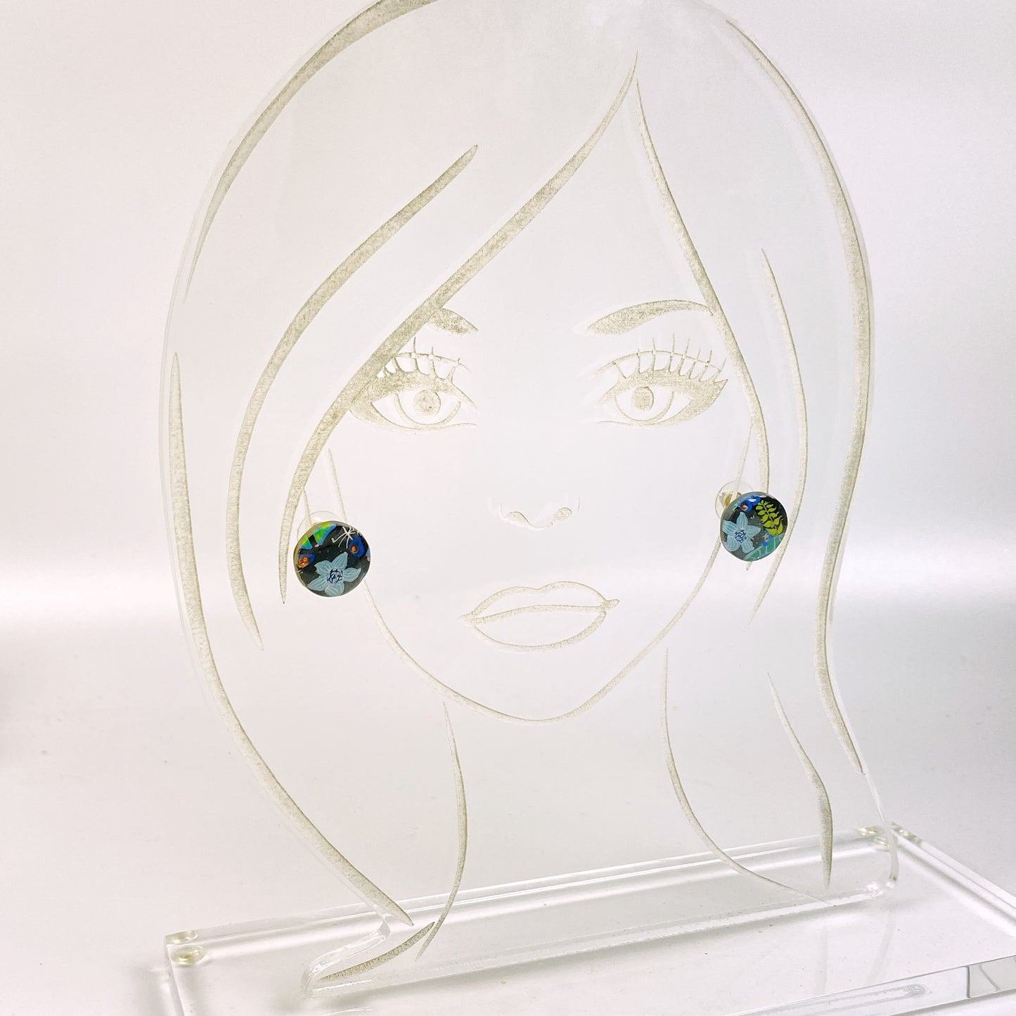 Blue Blossom Handmade Polymer Clay Stud Earrings on an acrylic display head