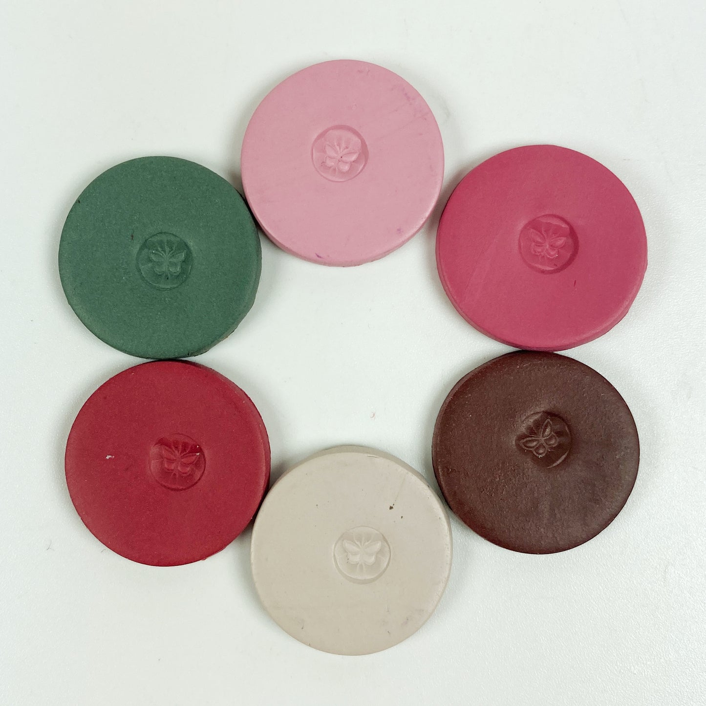 Discs of Polymer Clay in all 6 coffee colors of this palette, arranged in a ring.